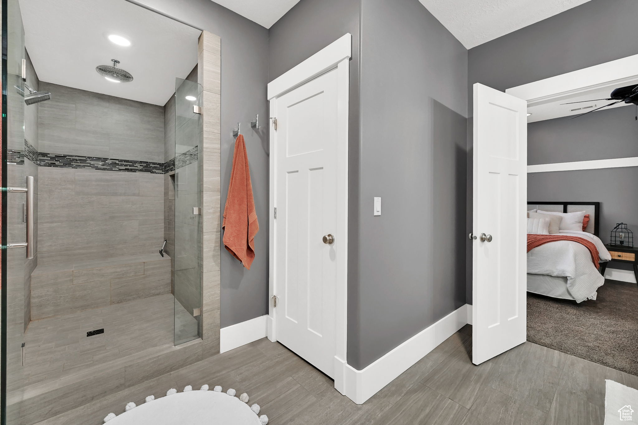 Bathroom with a rain shower and glass door