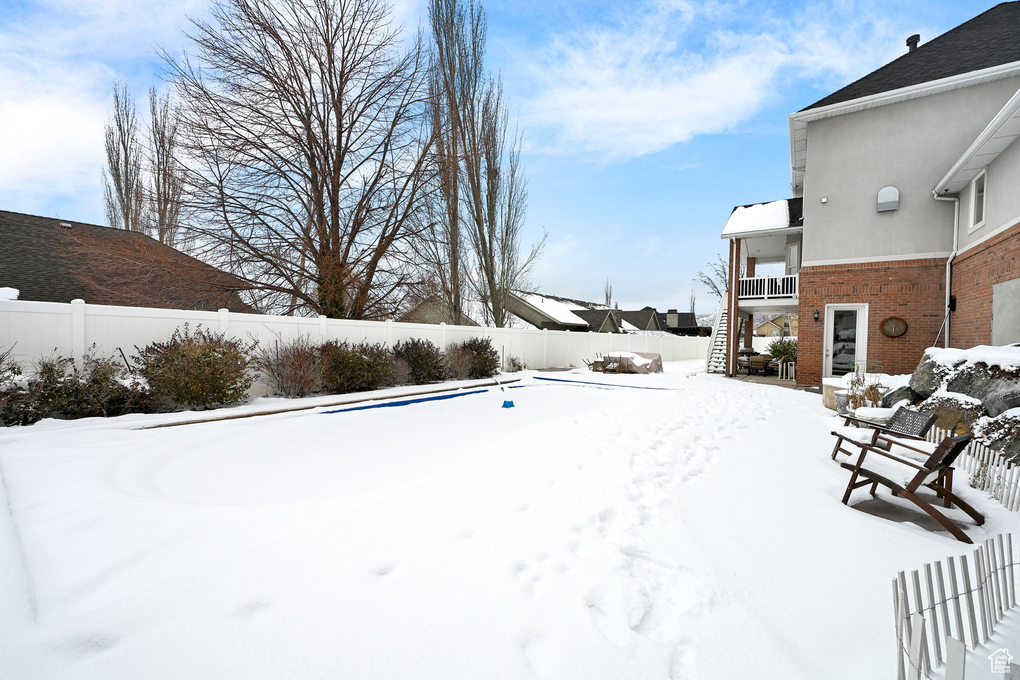 View of yard covered in snow