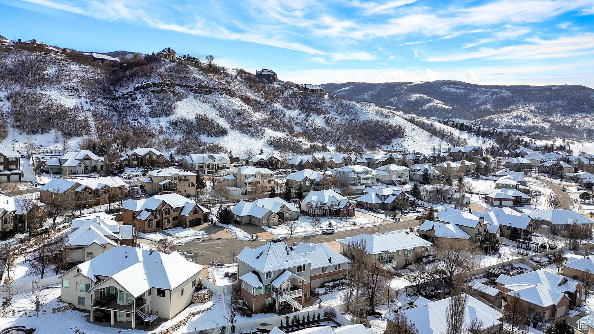 Snowy aerial view featuring a mountain view