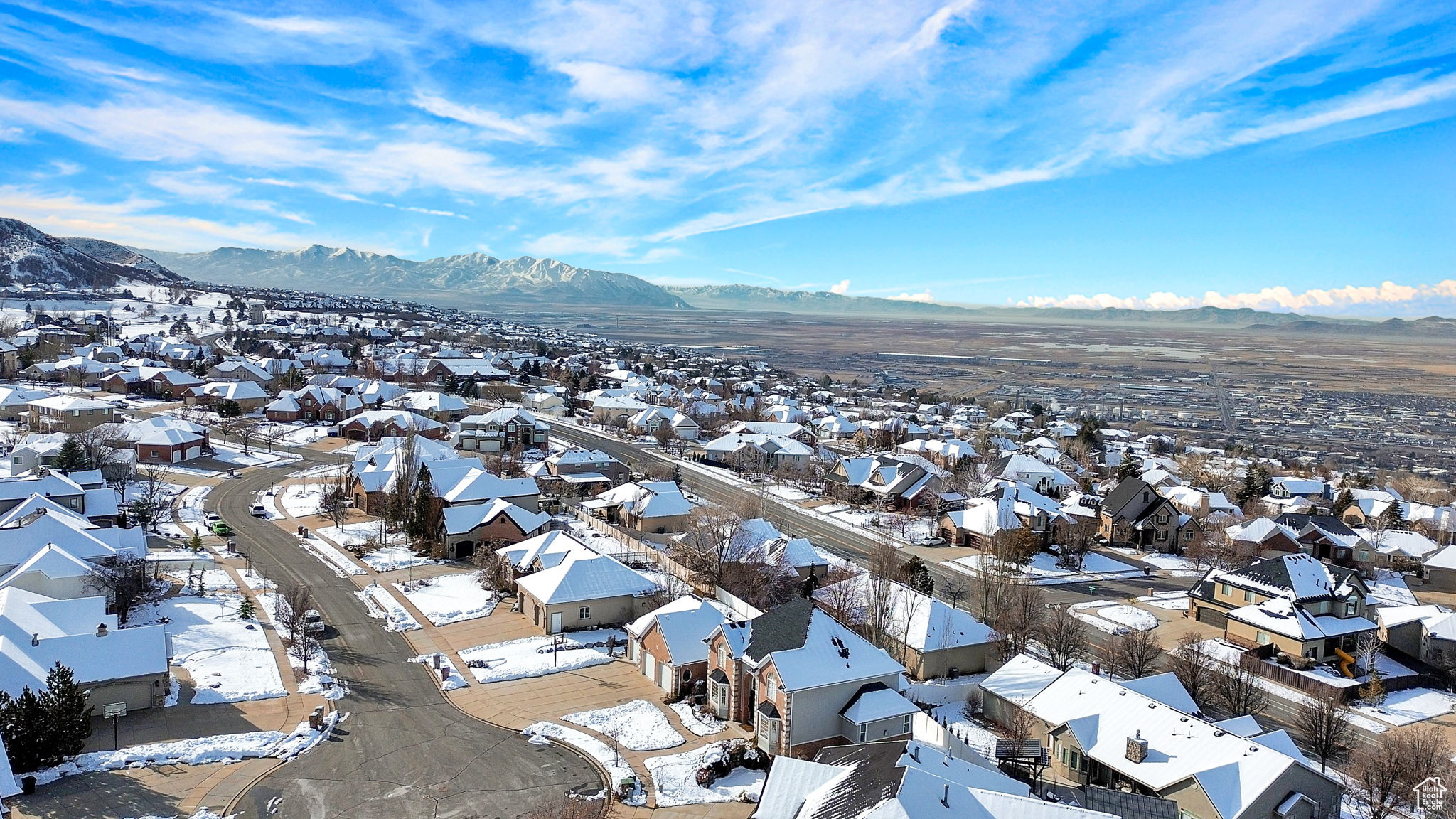 Snowy aerial view with a mountain view