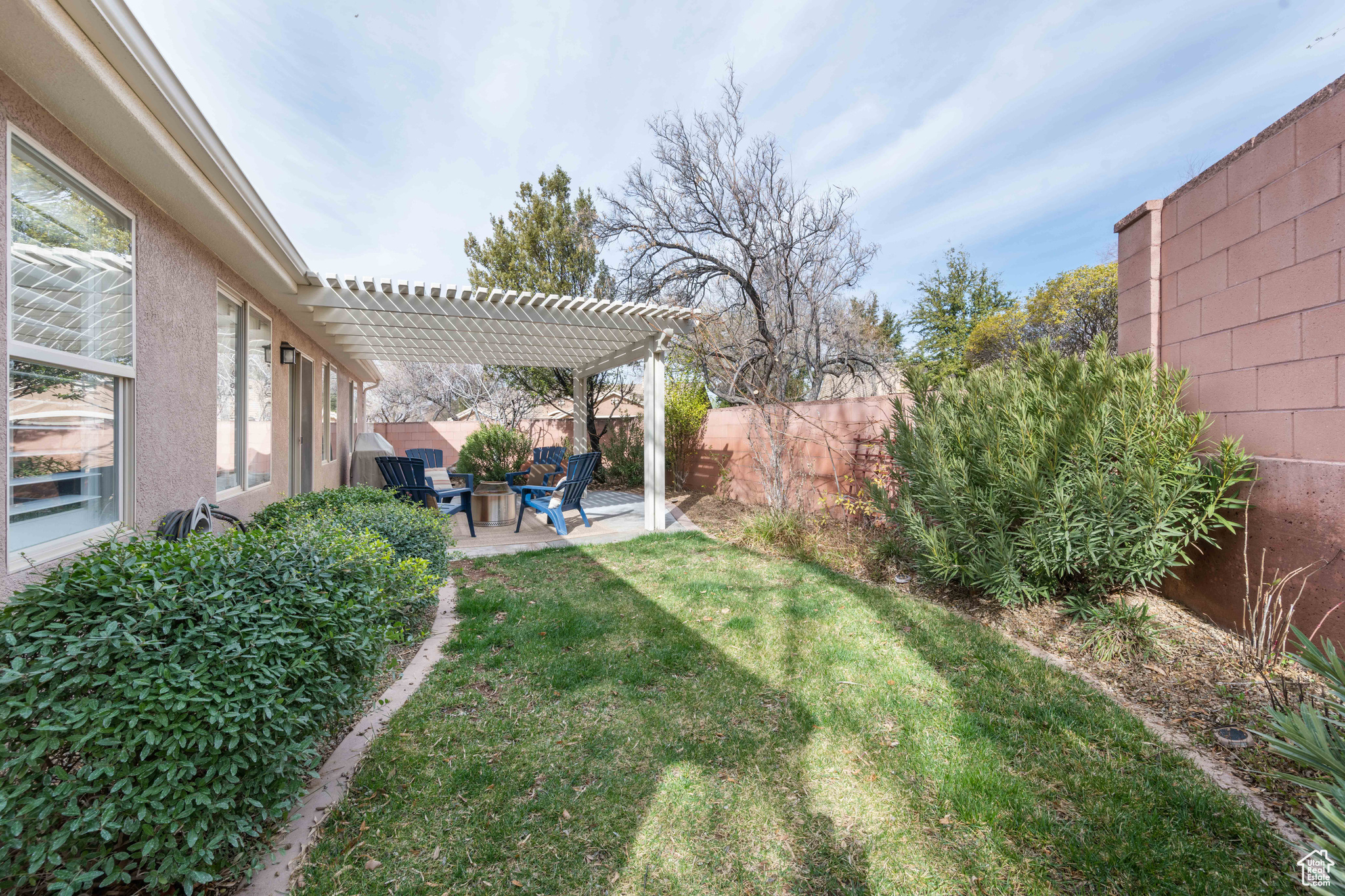 View of yard featuring a fenced backyard, a pergola, and a patio