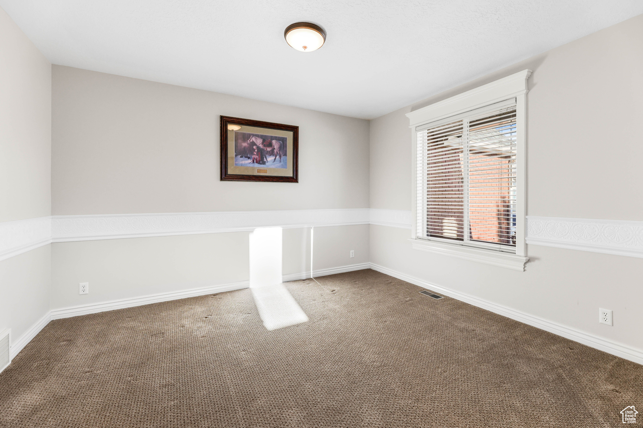 View of carpeted spare room