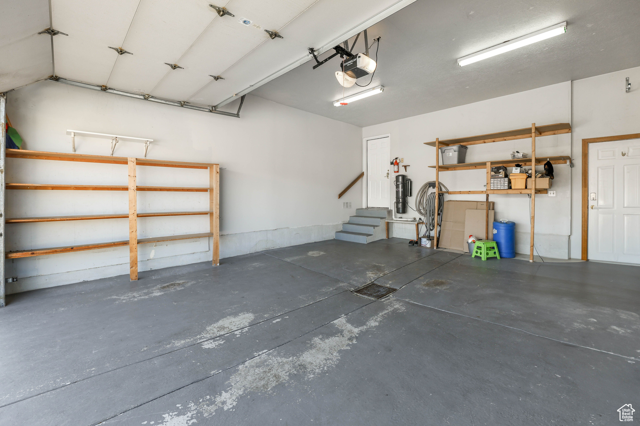 Garage featuring a garage door opener