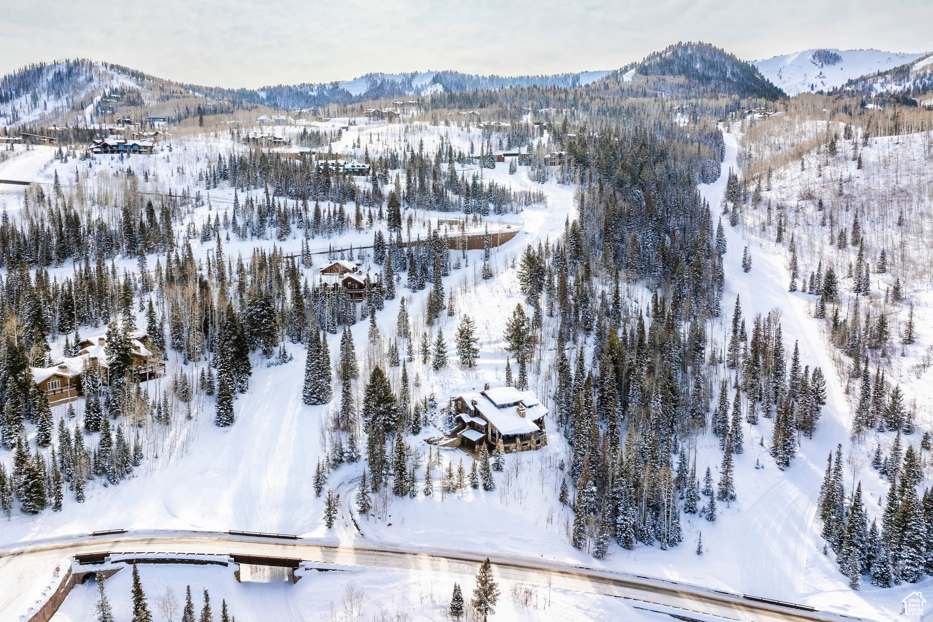 Snowy aerial view with a mountain view