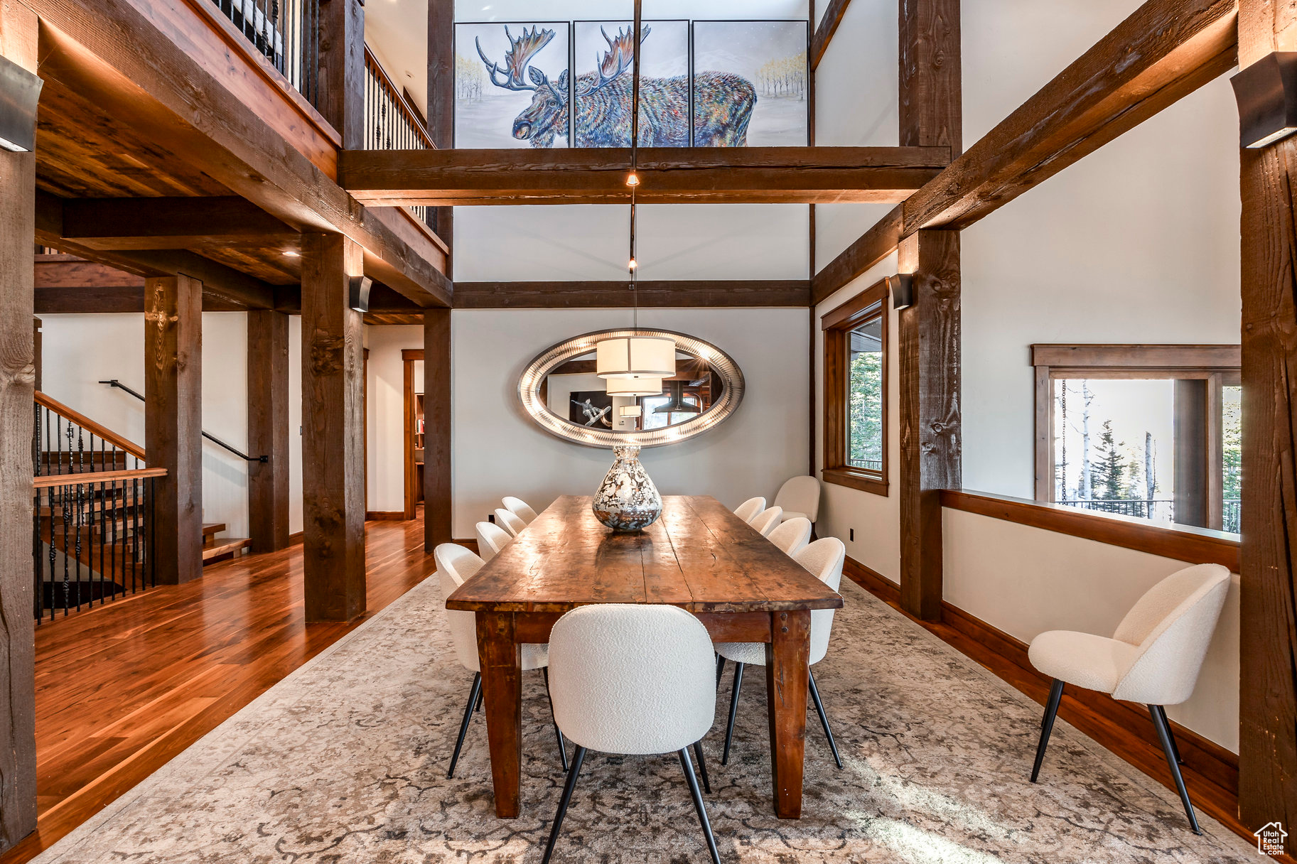 Dining space featuring hardwood / wood-style flooring and beamed ceiling