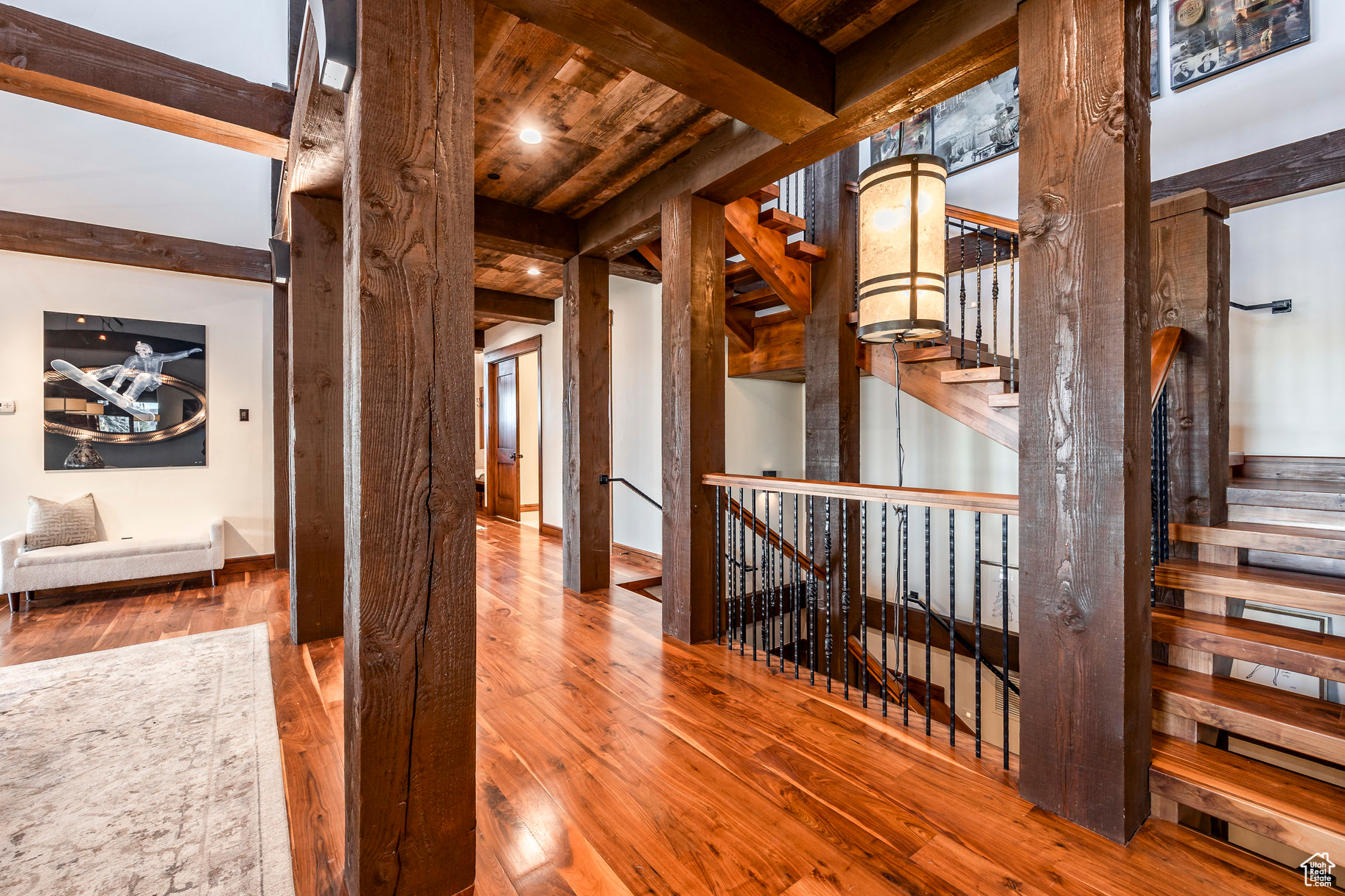 Hallway with beam ceiling, hardwood / wood-style flooring, and wood ceiling