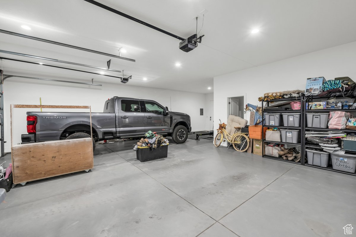 Garage featuring a garage door opener