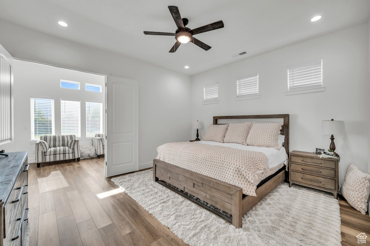 Bedroom featuring hardwood / wood-style floors and ceiling fan