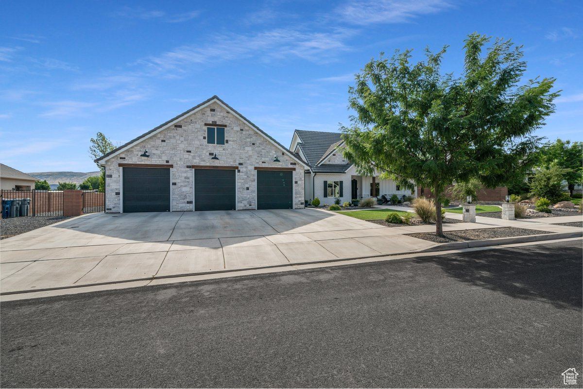 View of front facade featuring a garage
