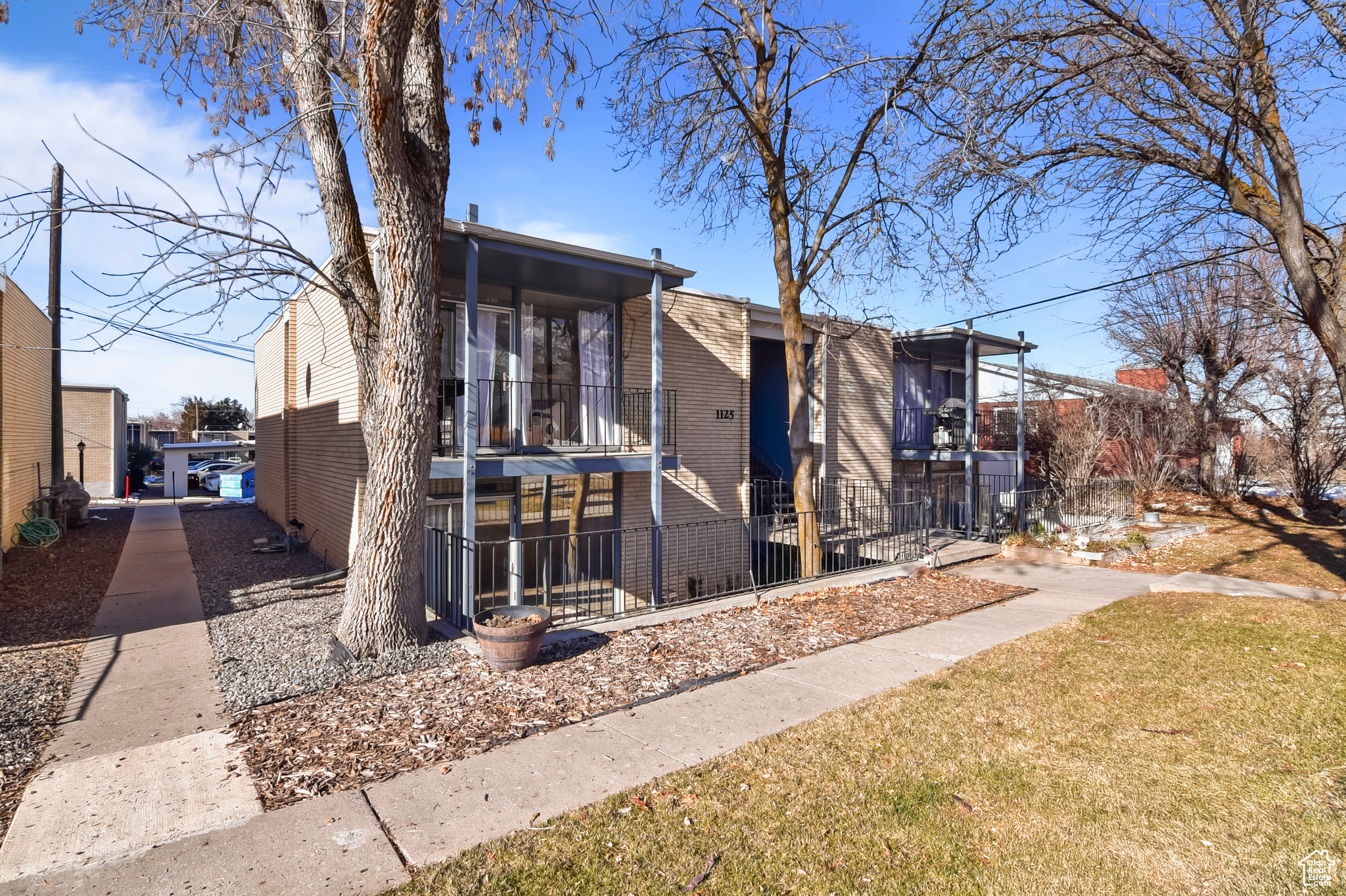 View of the front of home with lower level patio