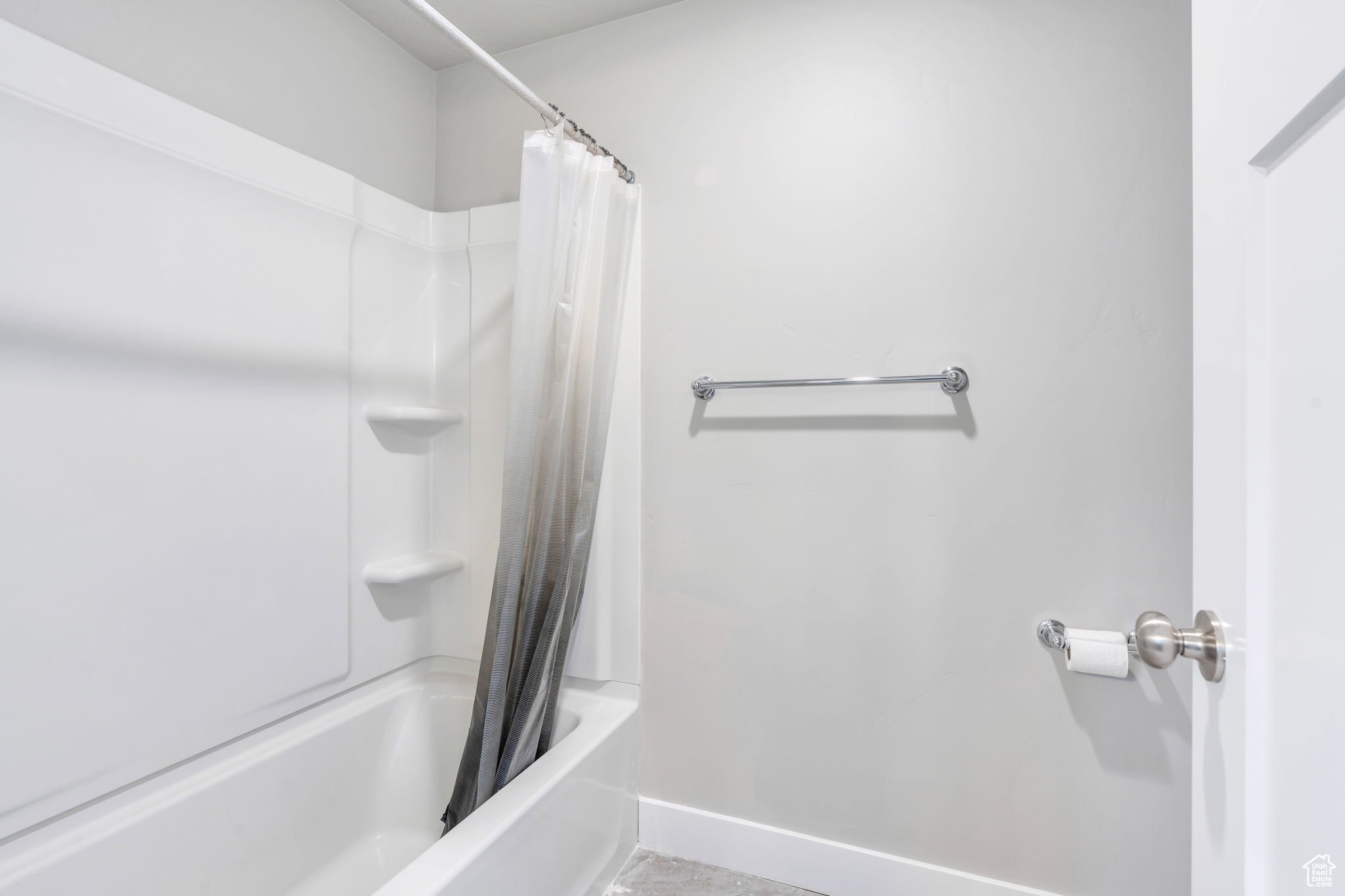 Bathroom with shower / bath combo with shower curtain