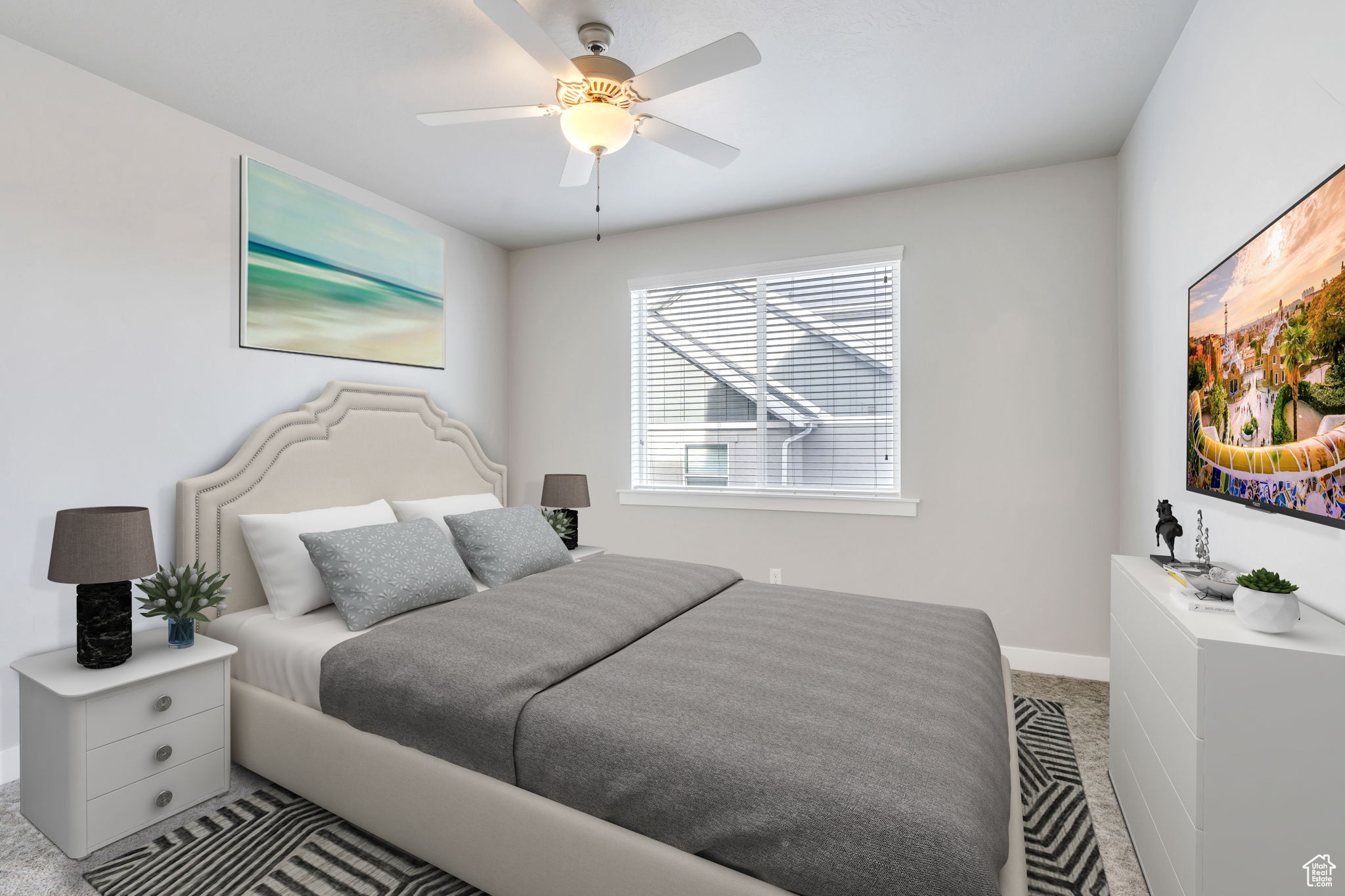 Carpeted bedroom featuring ceiling fan