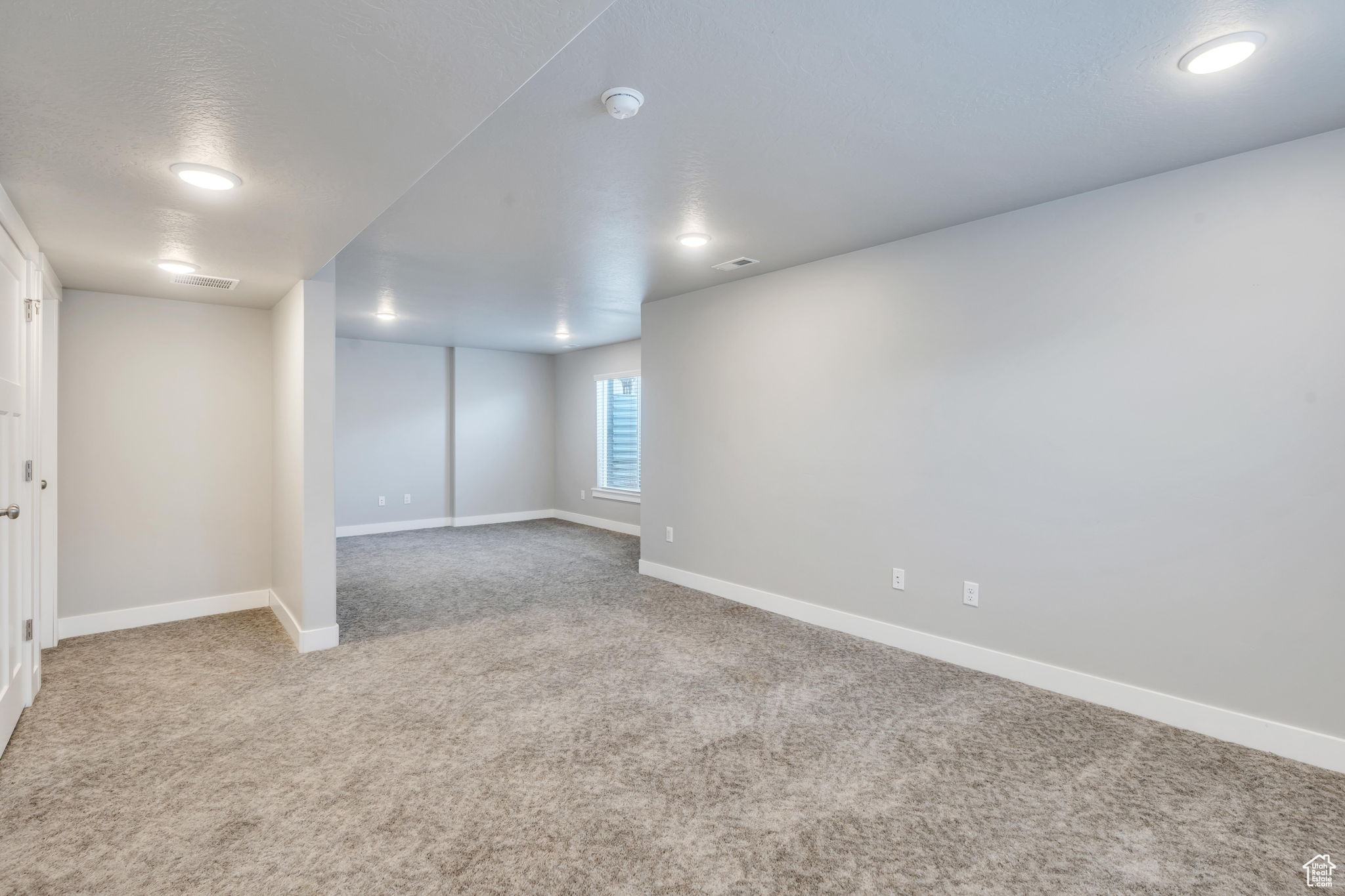 Basement featuring carpet flooring