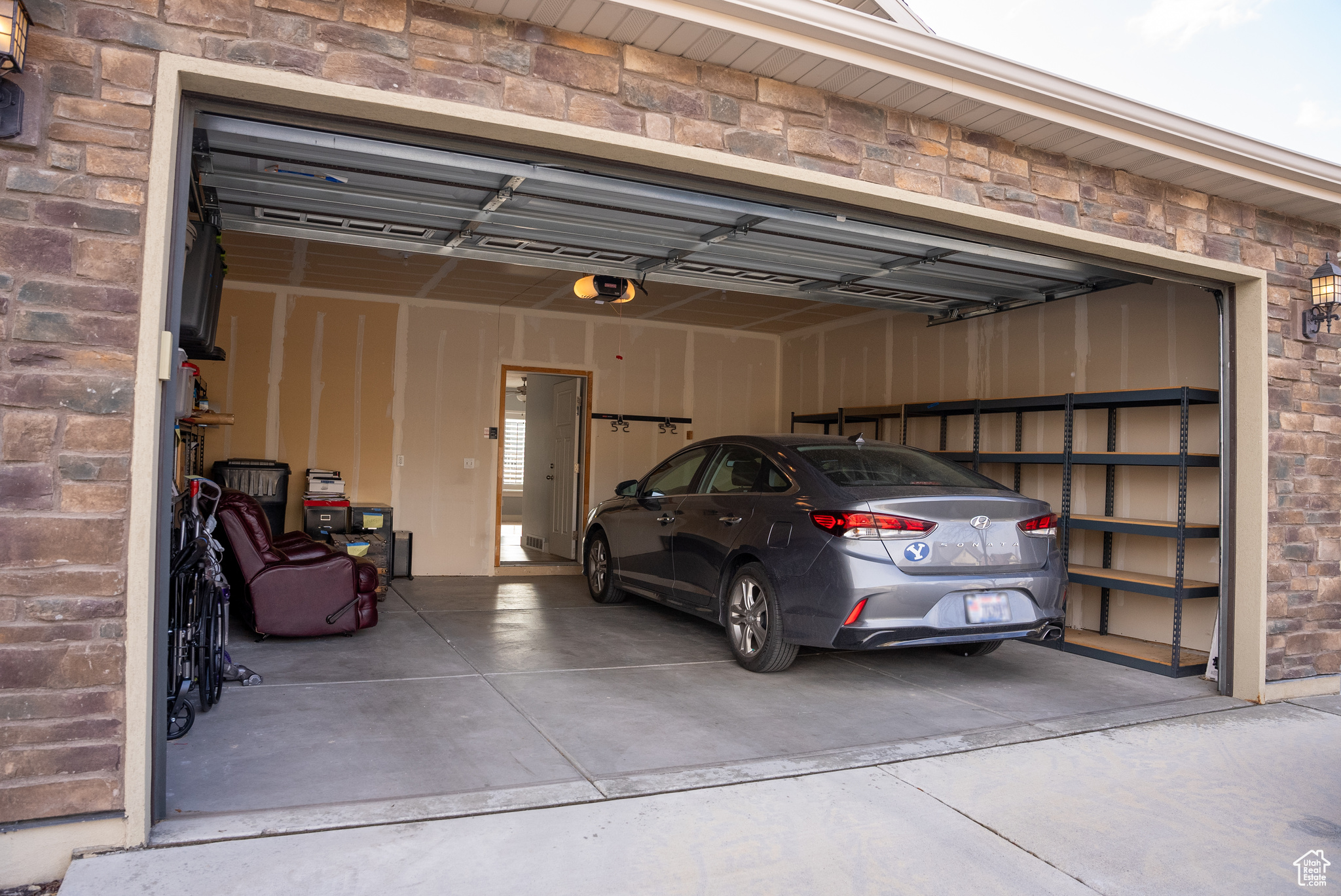 Garage featuring a garage door opener