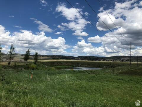 View of yard with a rural view
