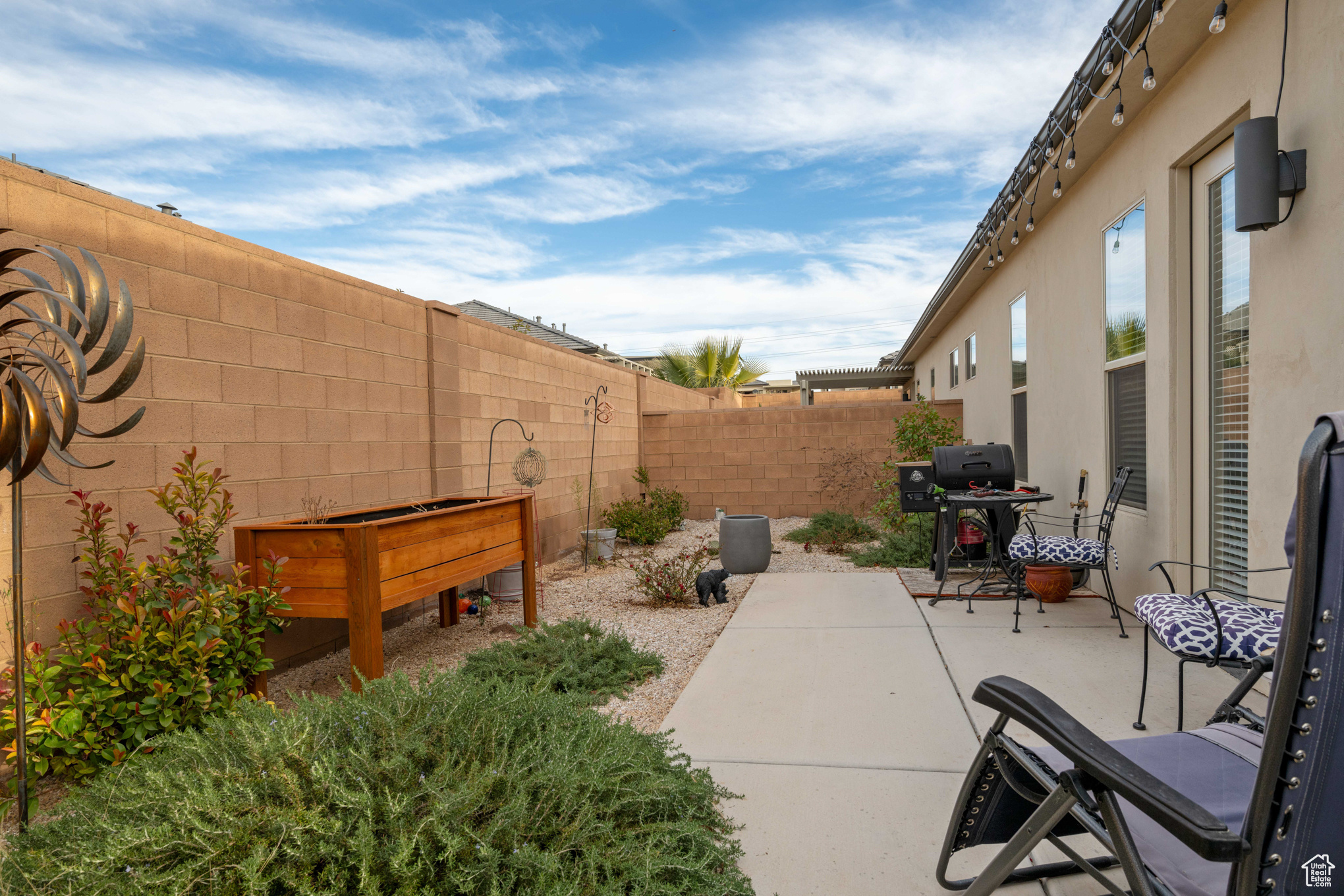 View of patio featuring a grill