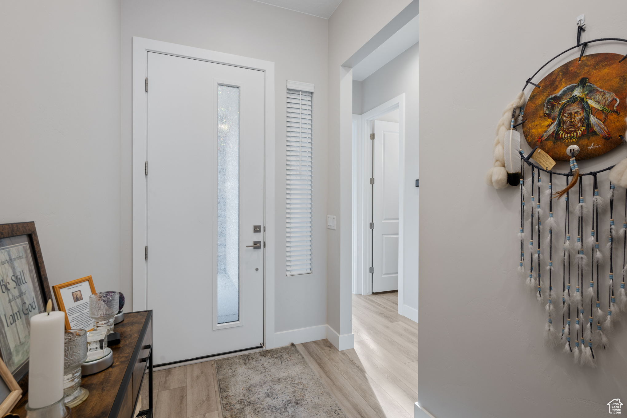 Entrance foyer featuring light hardwood / wood-style flooring