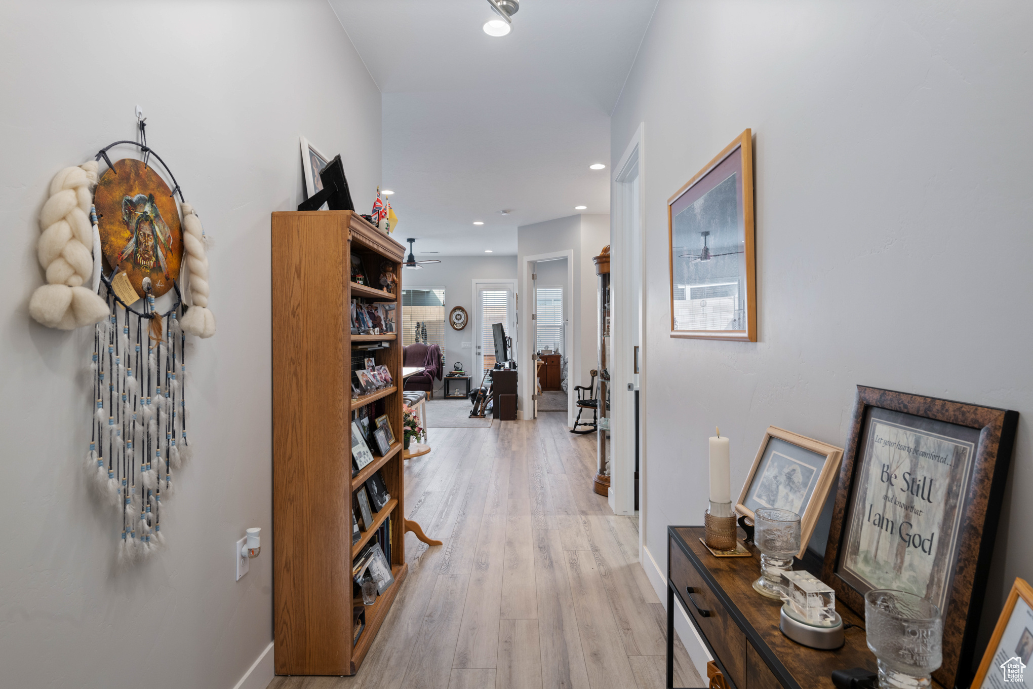 Corridor with light hardwood / wood-style floors