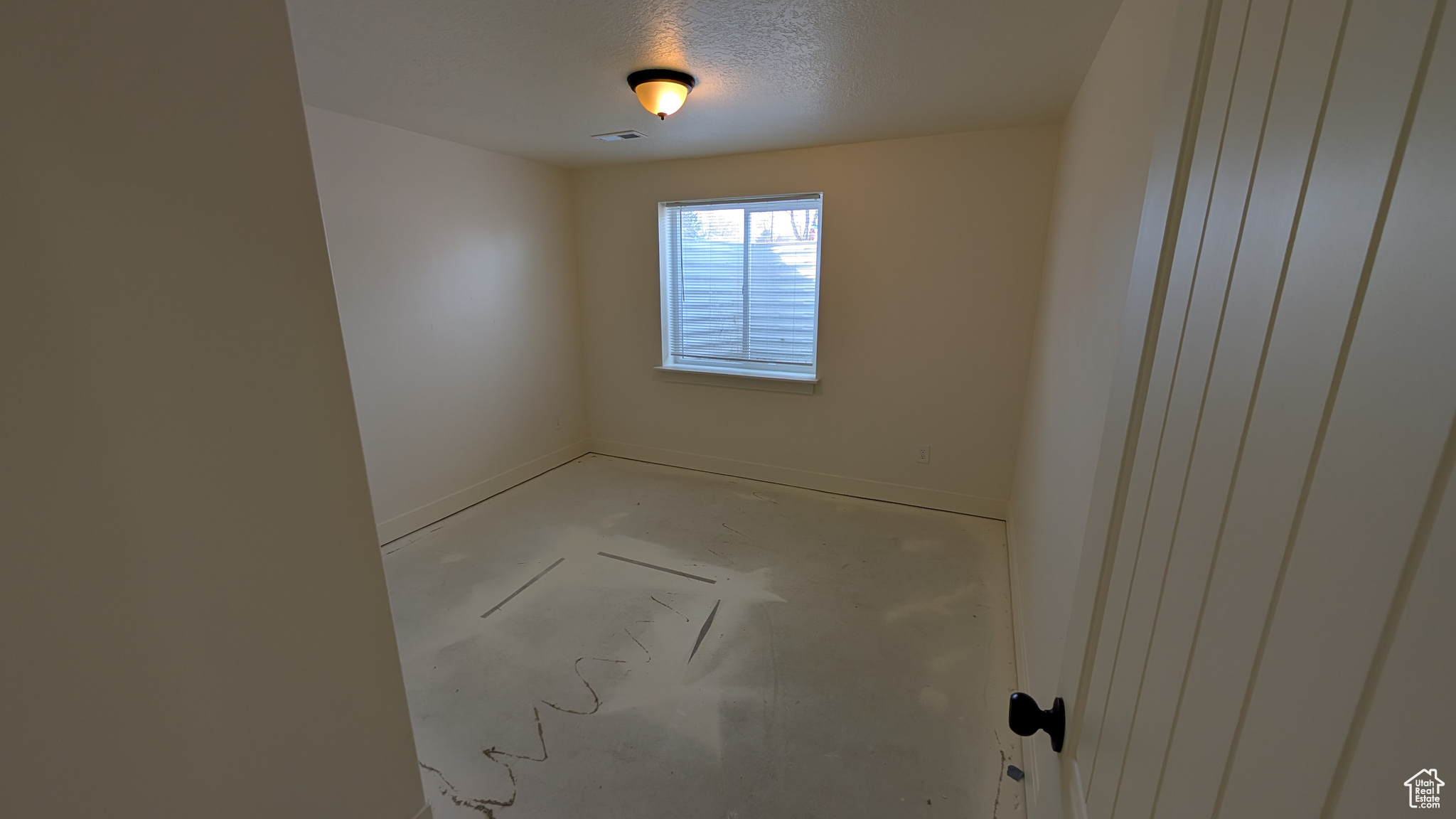 Spare room with a textured ceiling