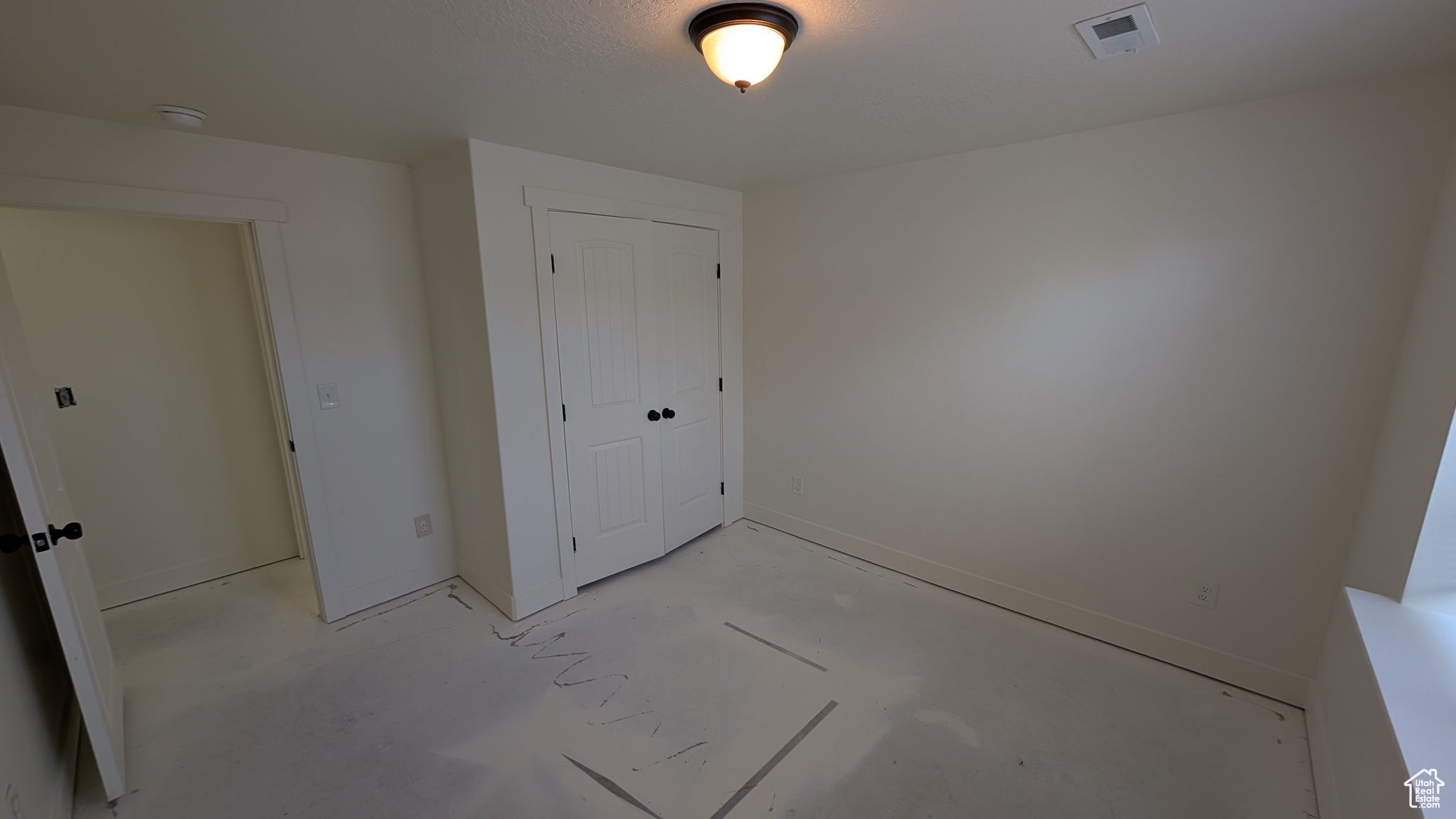 Unfurnished bedroom with a closet