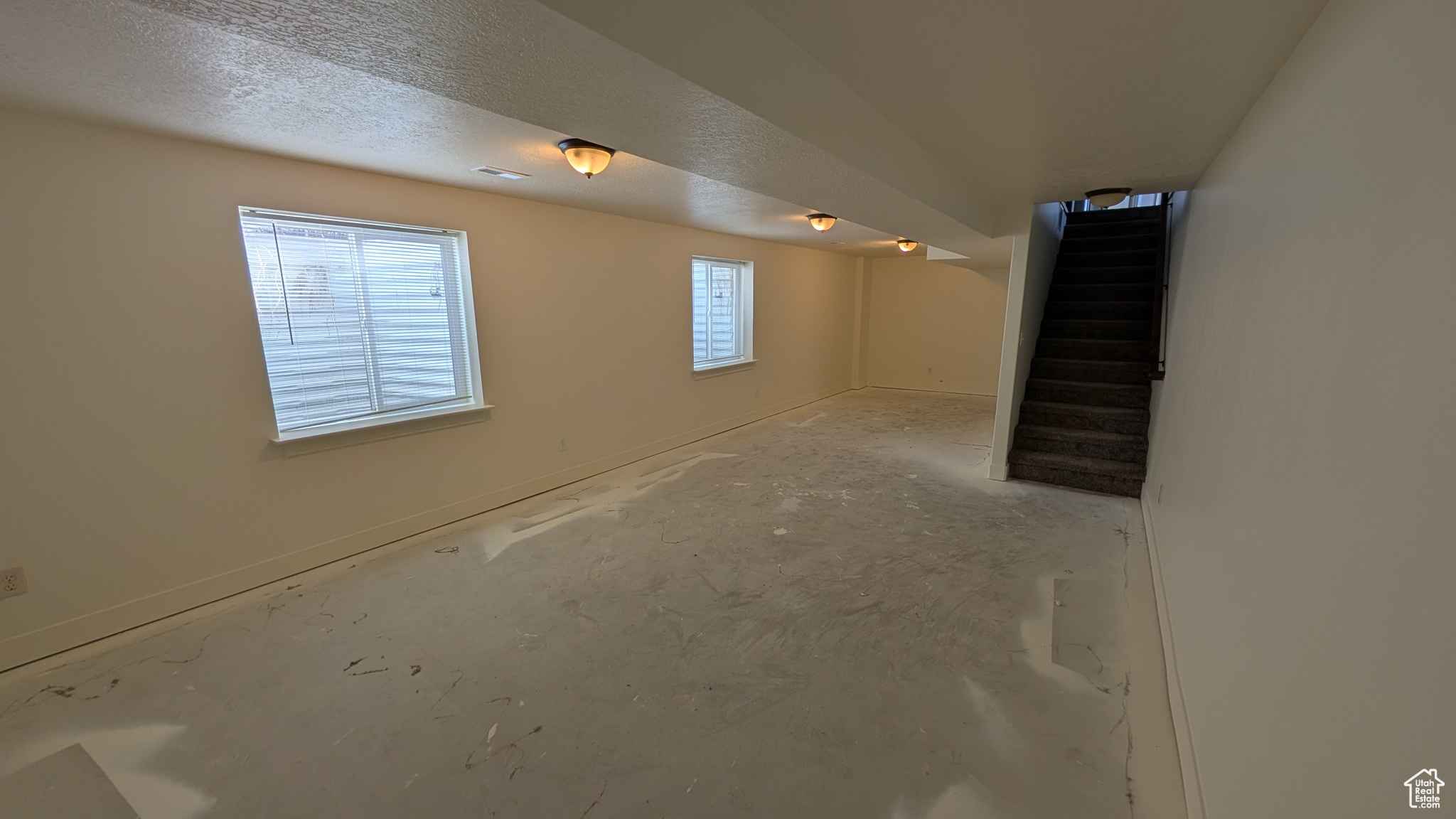 Basement with a textured ceiling