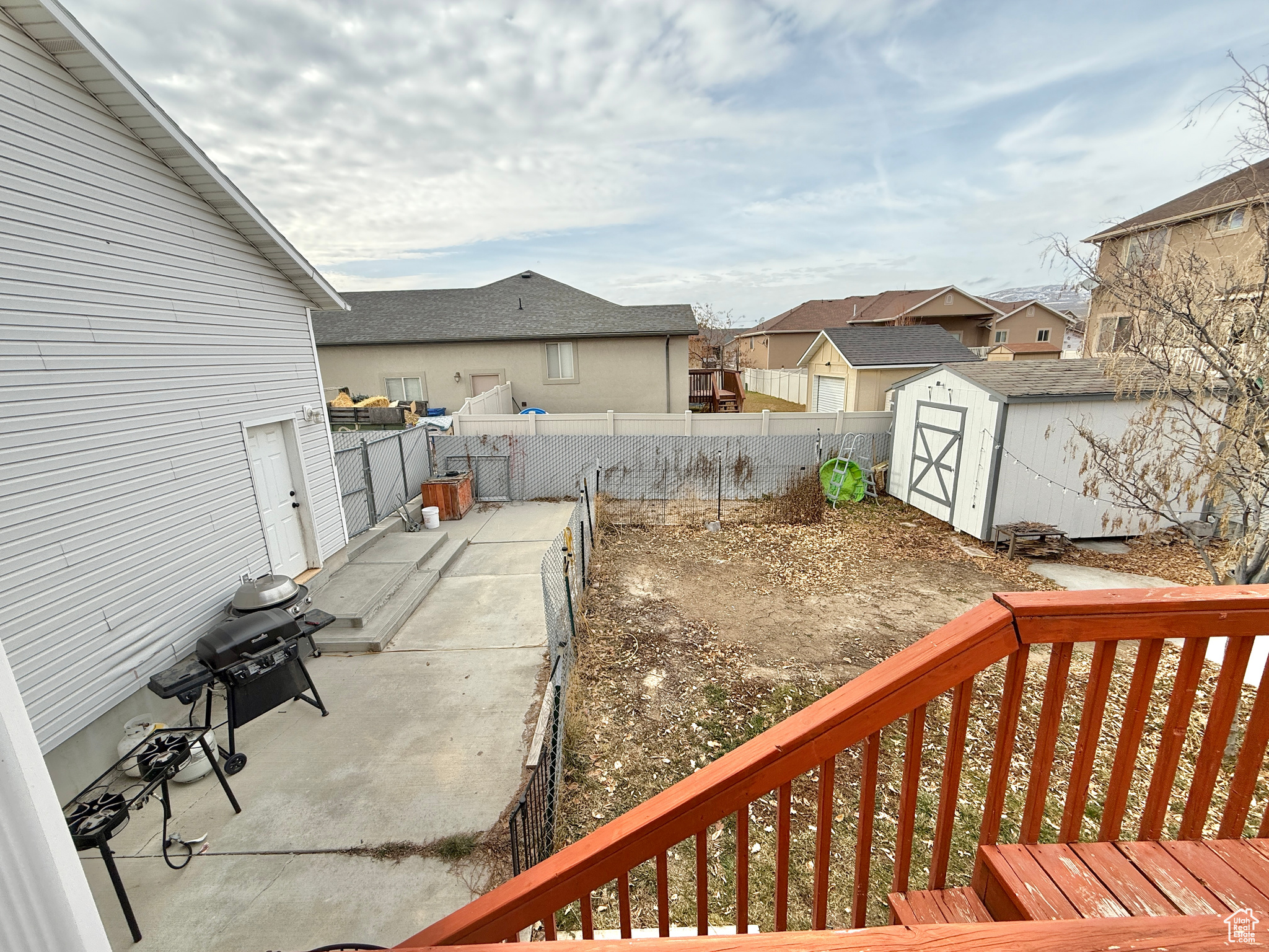 View of patio / terrace with a storage unit and a grill
