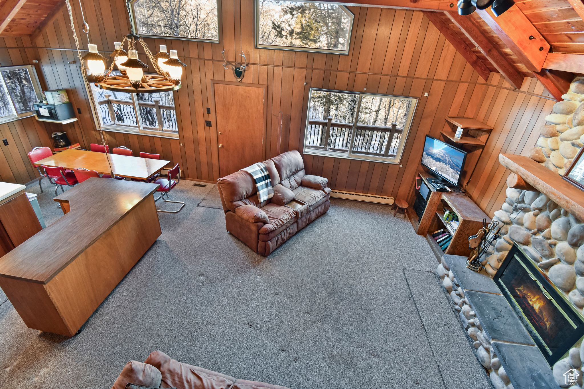 Living room featuring light carpet and wooden ceiling