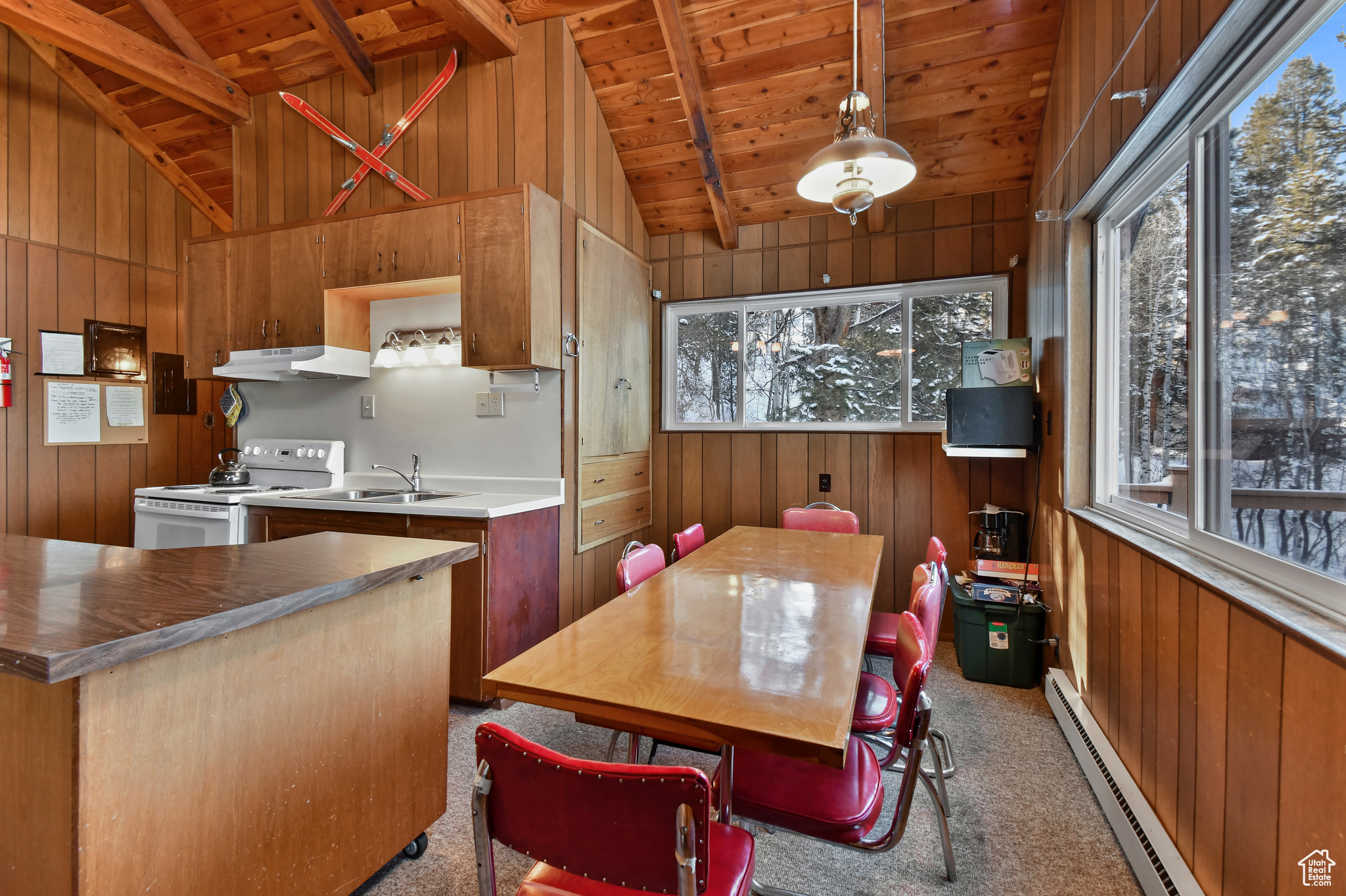 Kitchen with vaulted ceiling with beams, white electric range oven, wood ceiling, and a baseboard heating unit