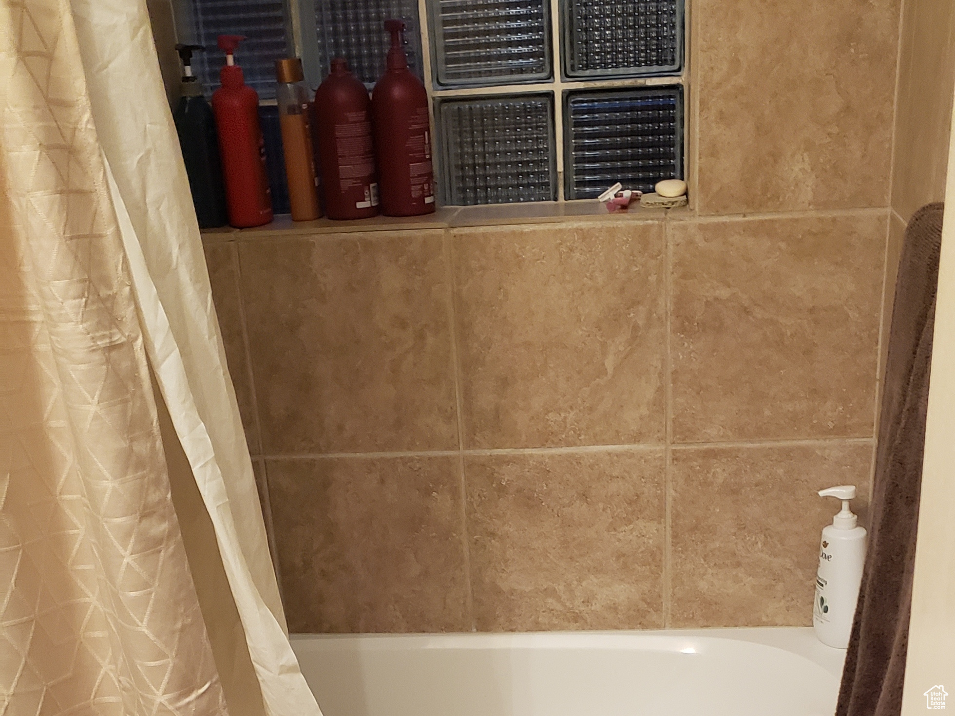 Bathroom with shower / bath combination.