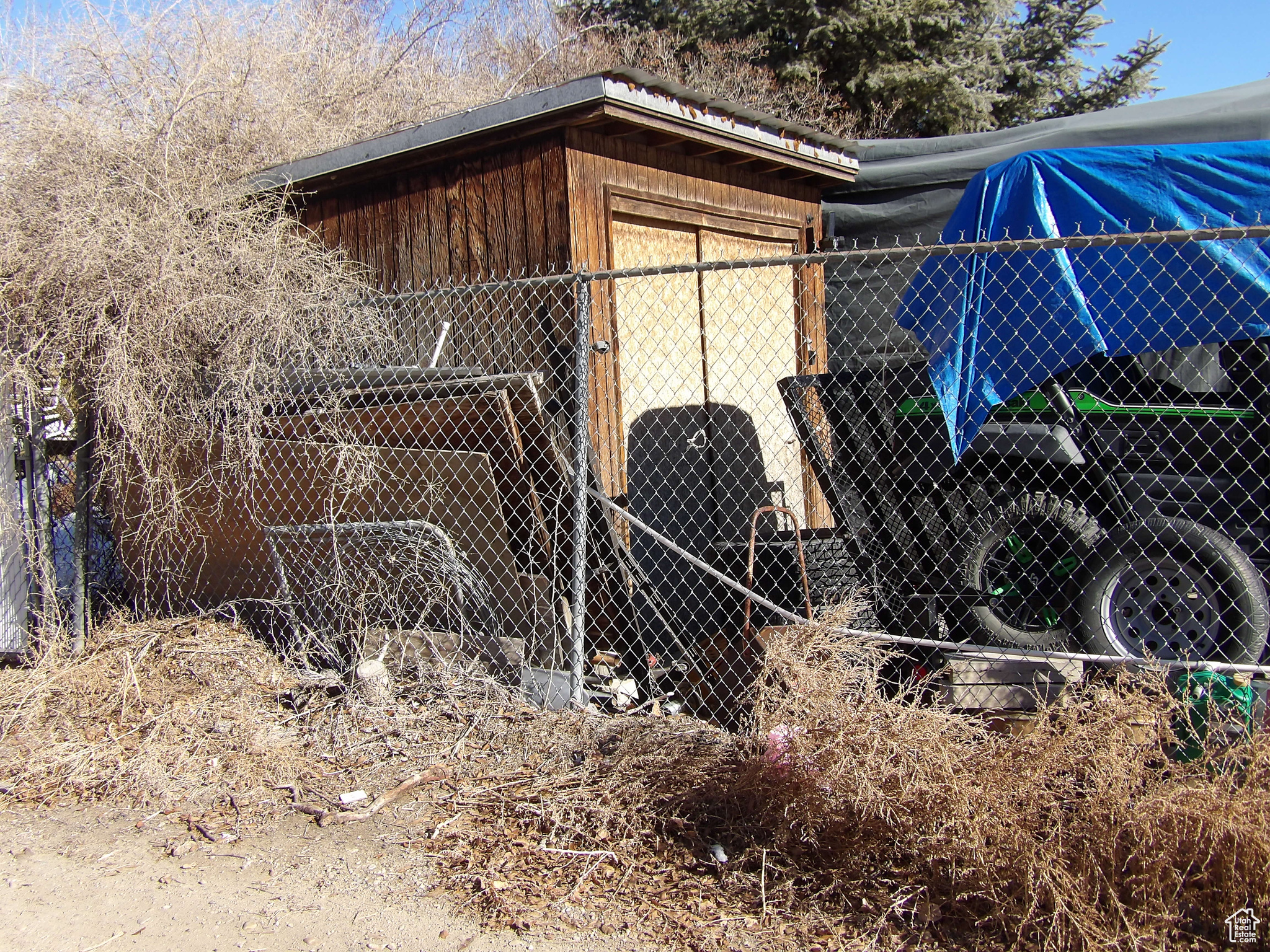 View of property exterior with an outdoor structure