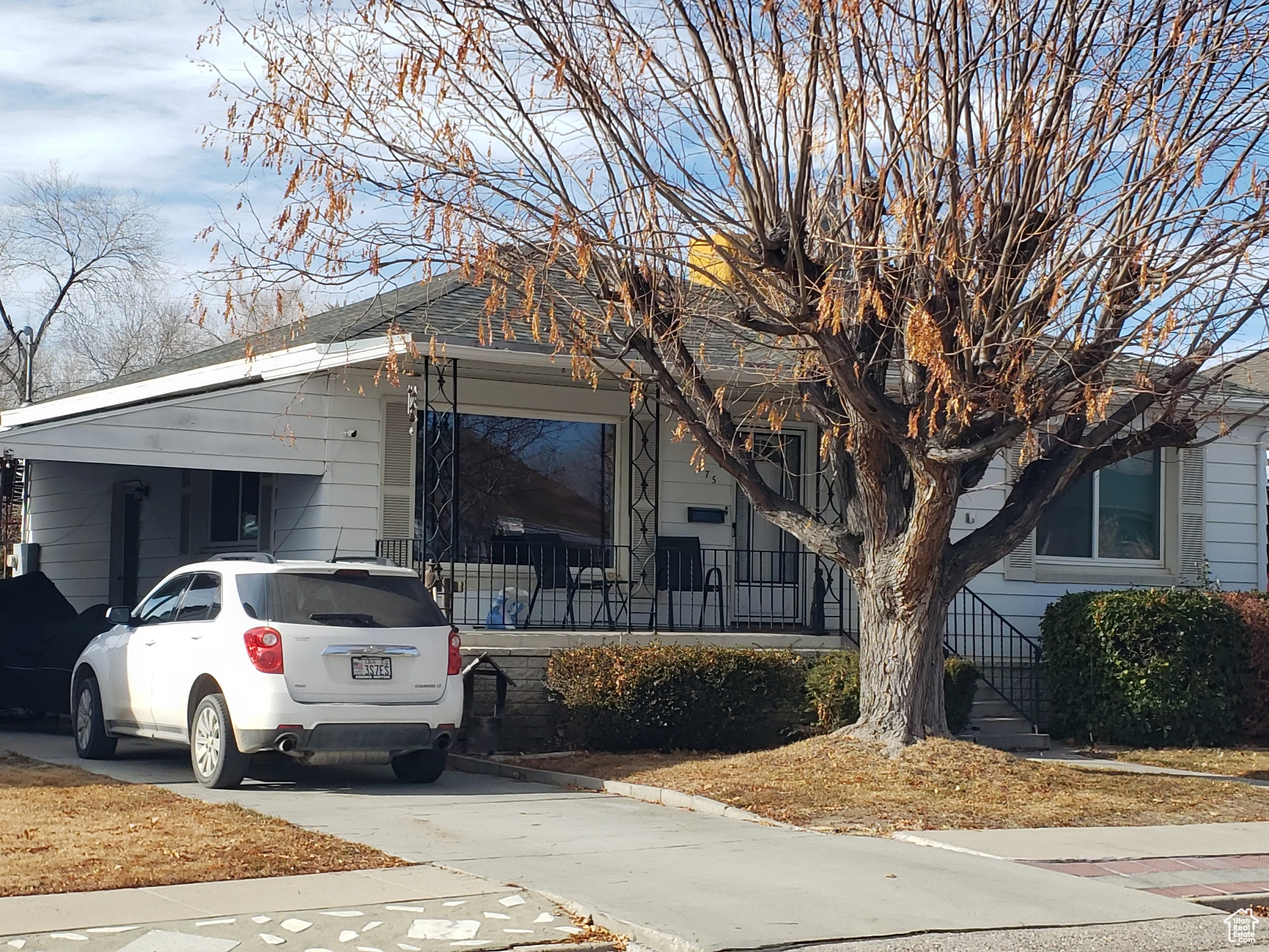View of front facade featuring a carport