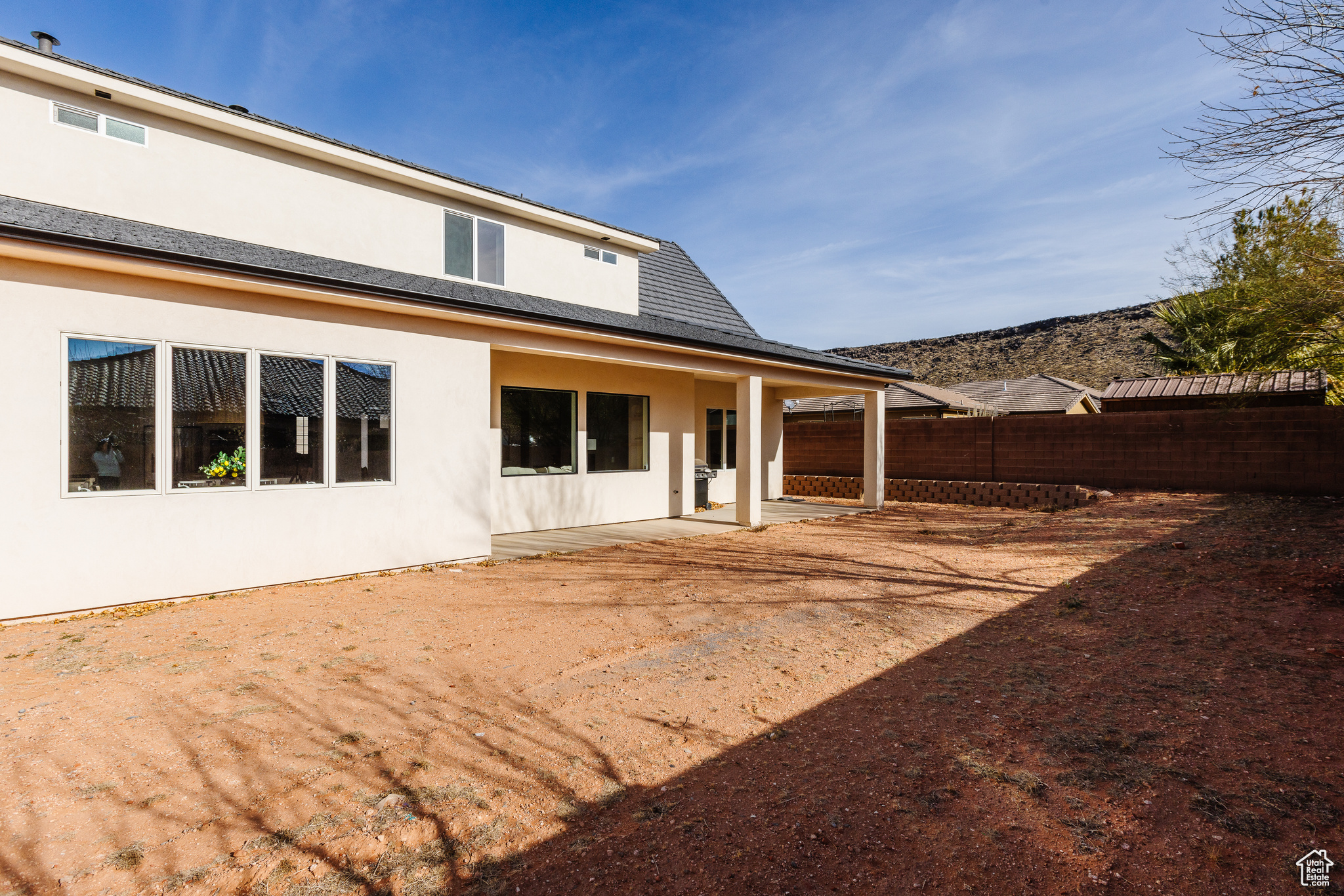 Rear view of property featuring a patio