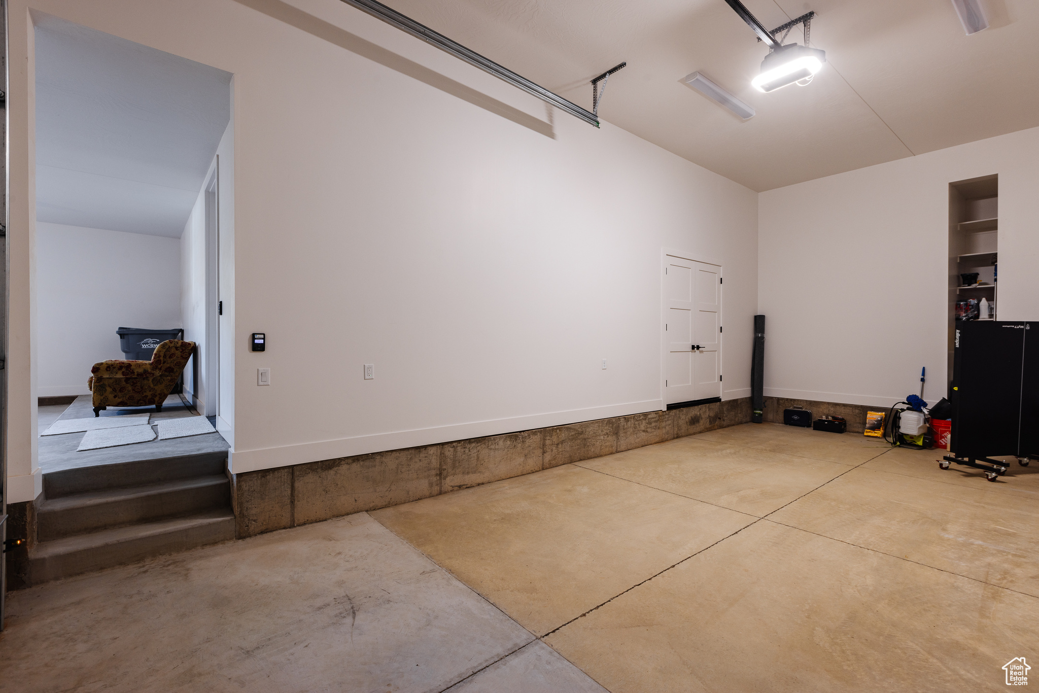 Garage featuring a garage door opener