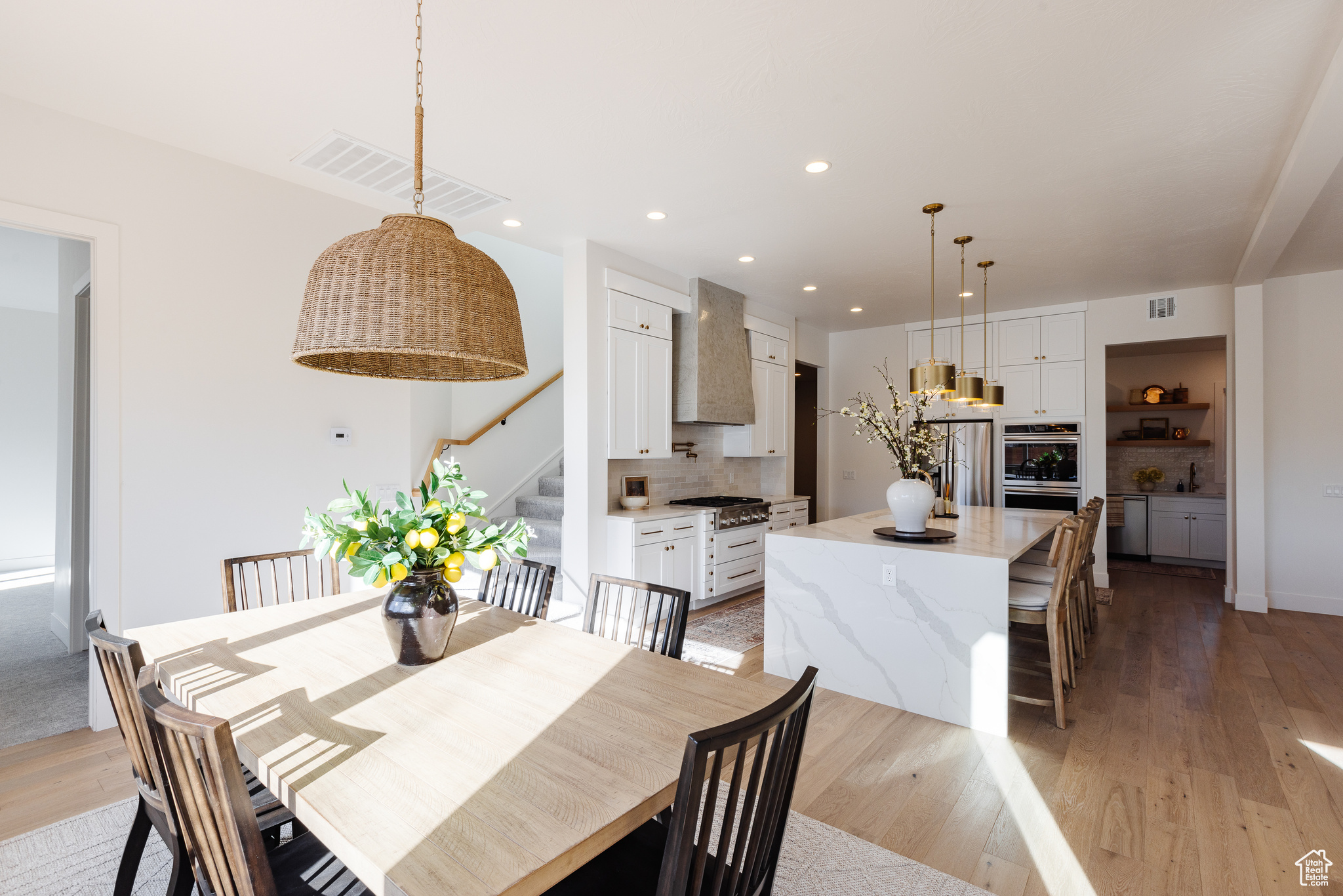 Dining room with light hardwood / wood-style flooring and sink