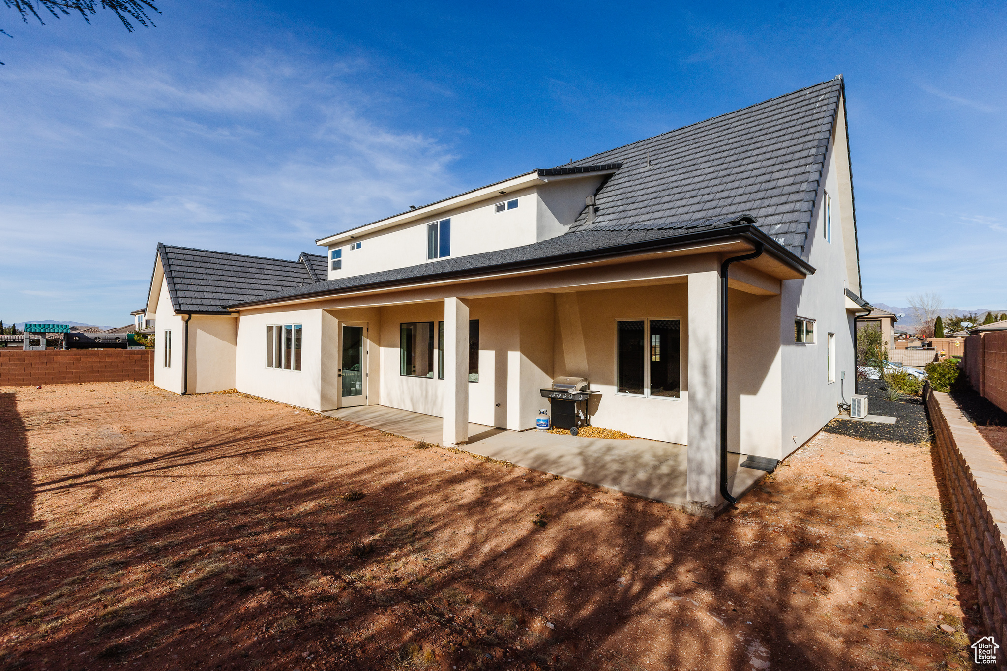 Rear view of house featuring a patio