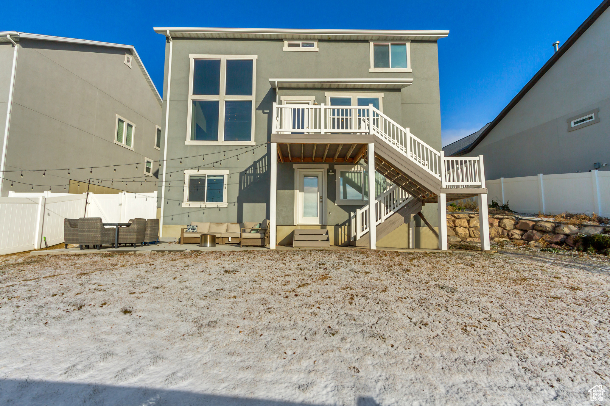 Back of house with a deck and outdoor lounge area