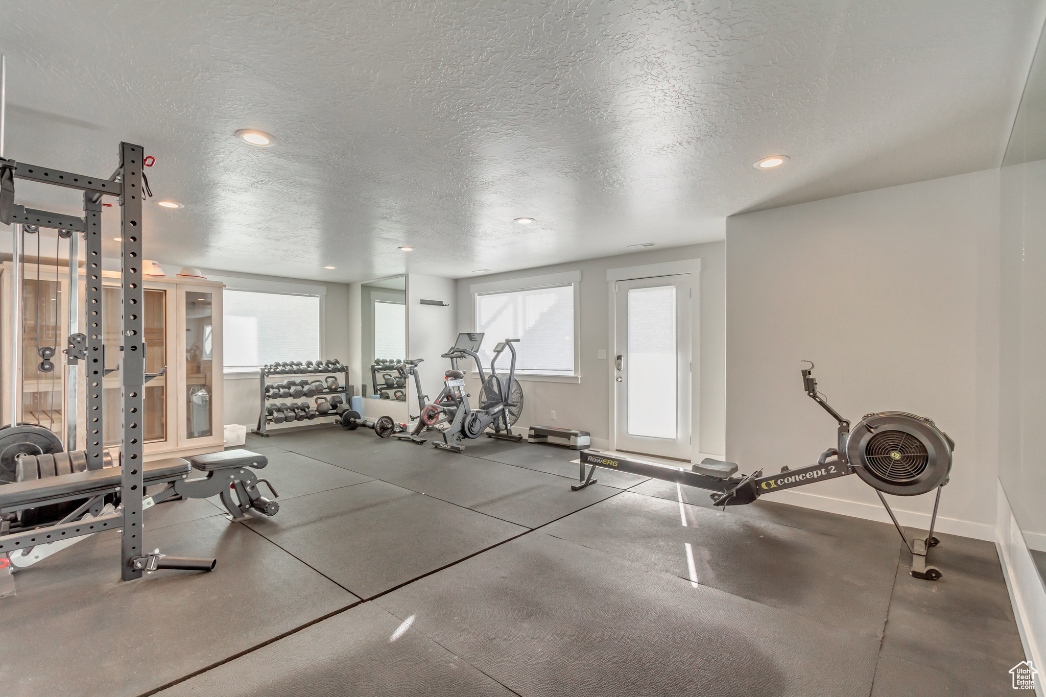 Workout area with a textured ceiling