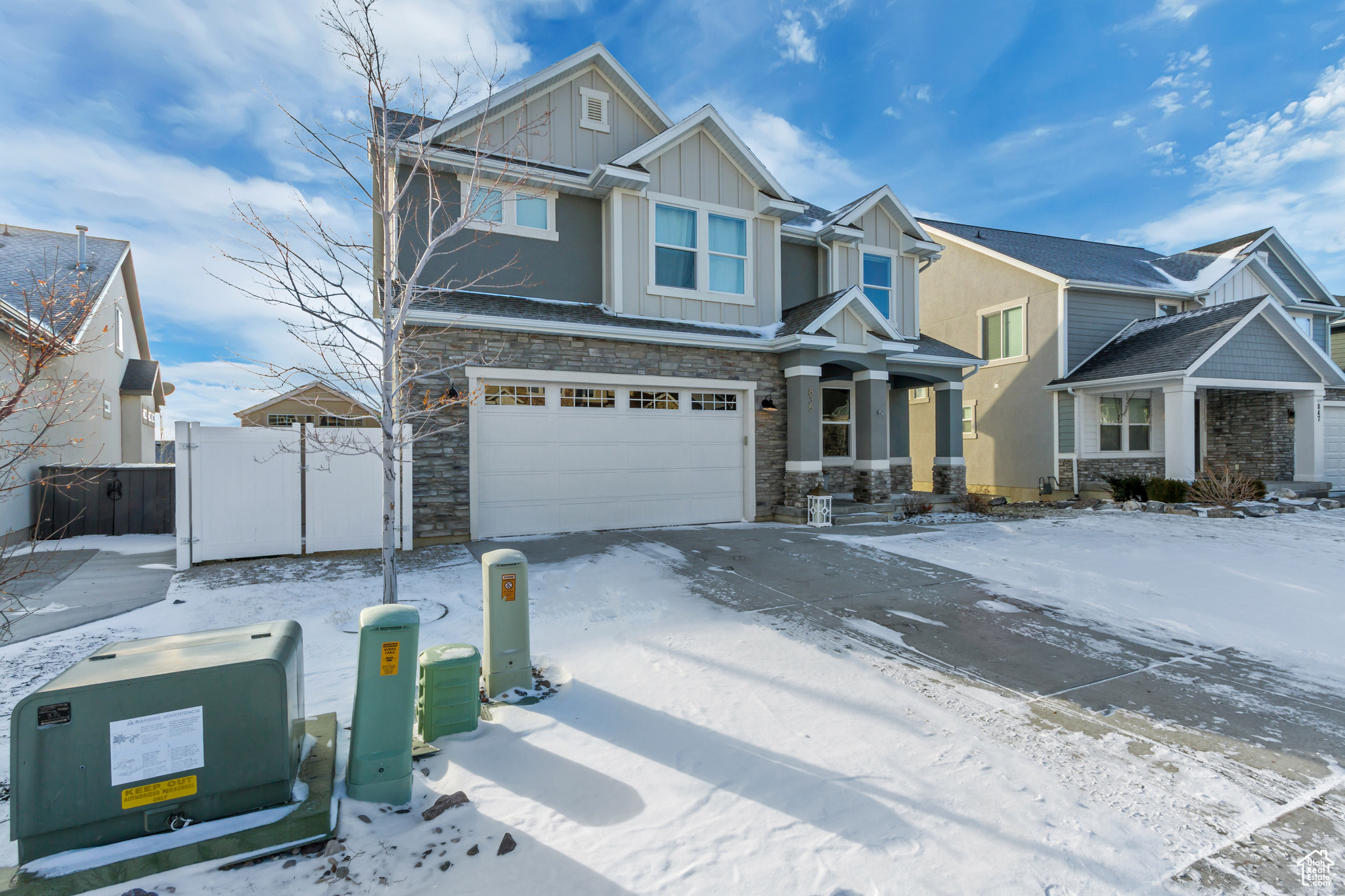 Craftsman-style home featuring a garage
