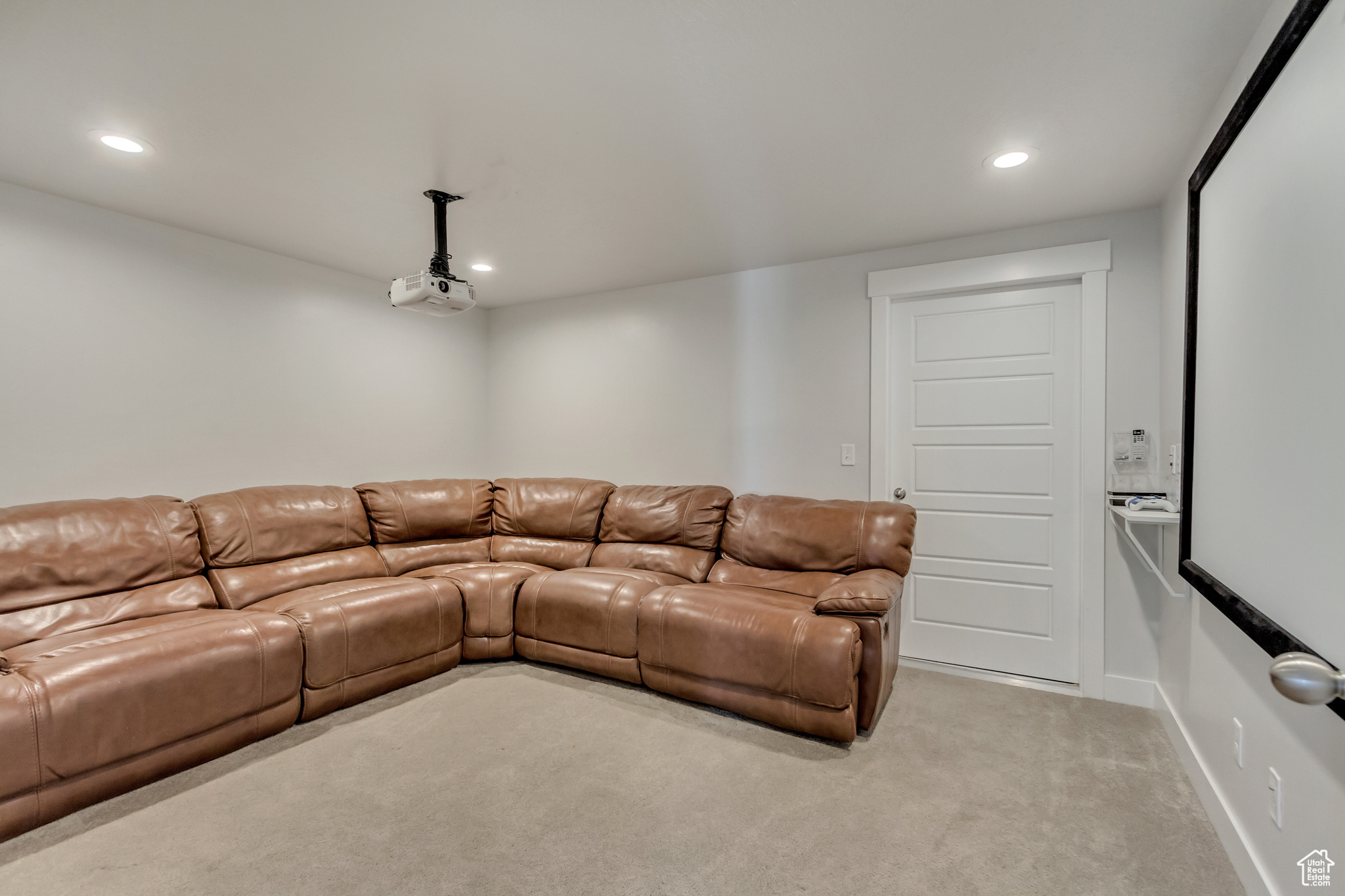 Living room featuring light colored carpet
