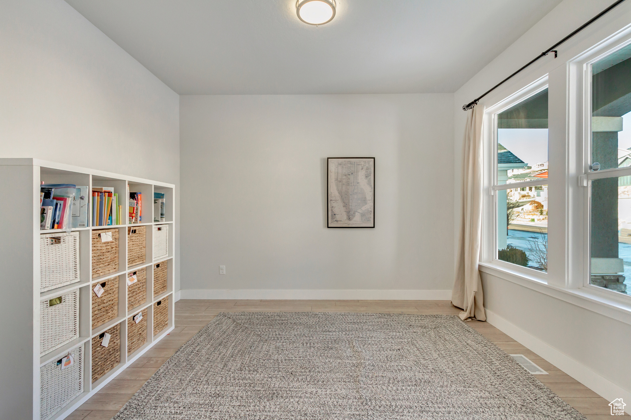 Spare room featuring light hardwood / wood-style floors