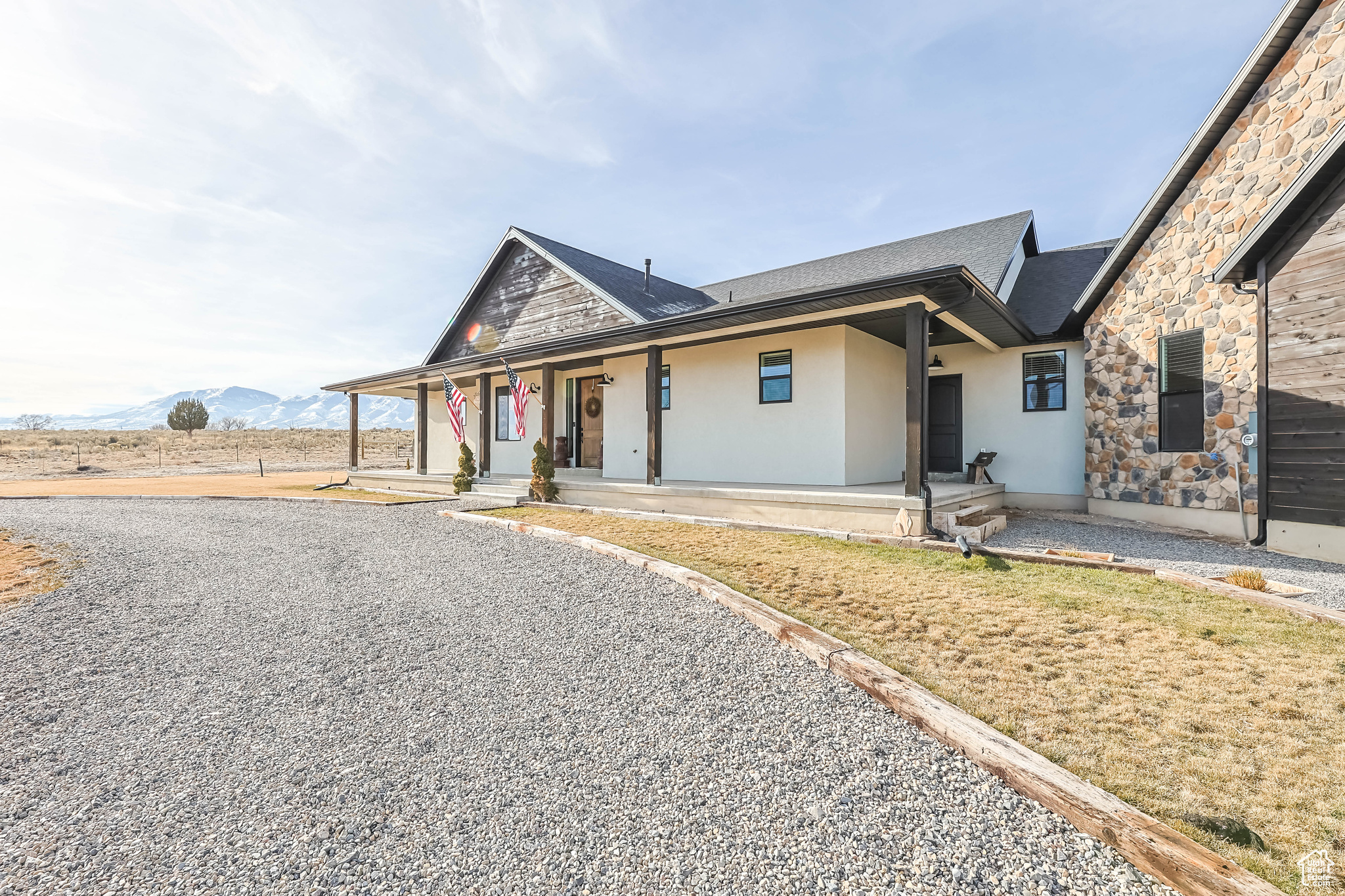 View of front of property featuring a mountain view and covered porch