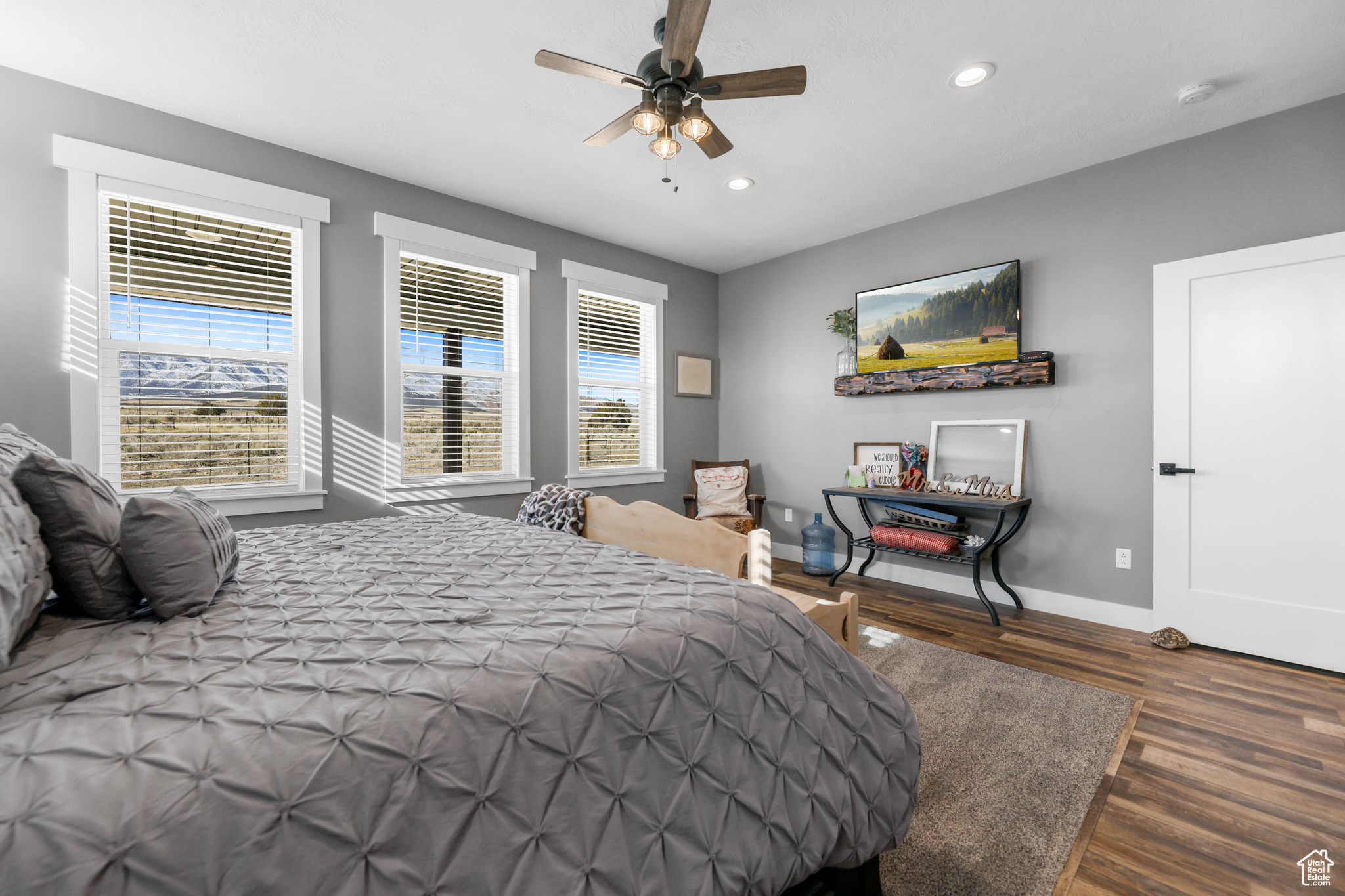 Bedroom featuring dark hardwood / wood-style flooring and ceiling fan