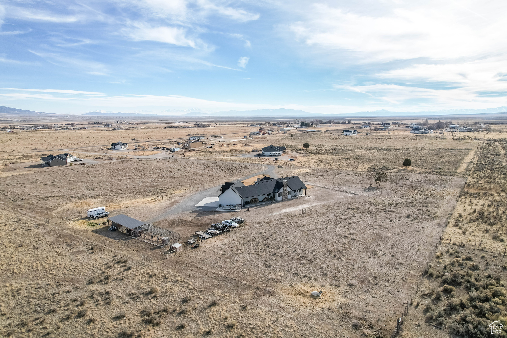 Birds eye view of property with a mountain view and a rural view