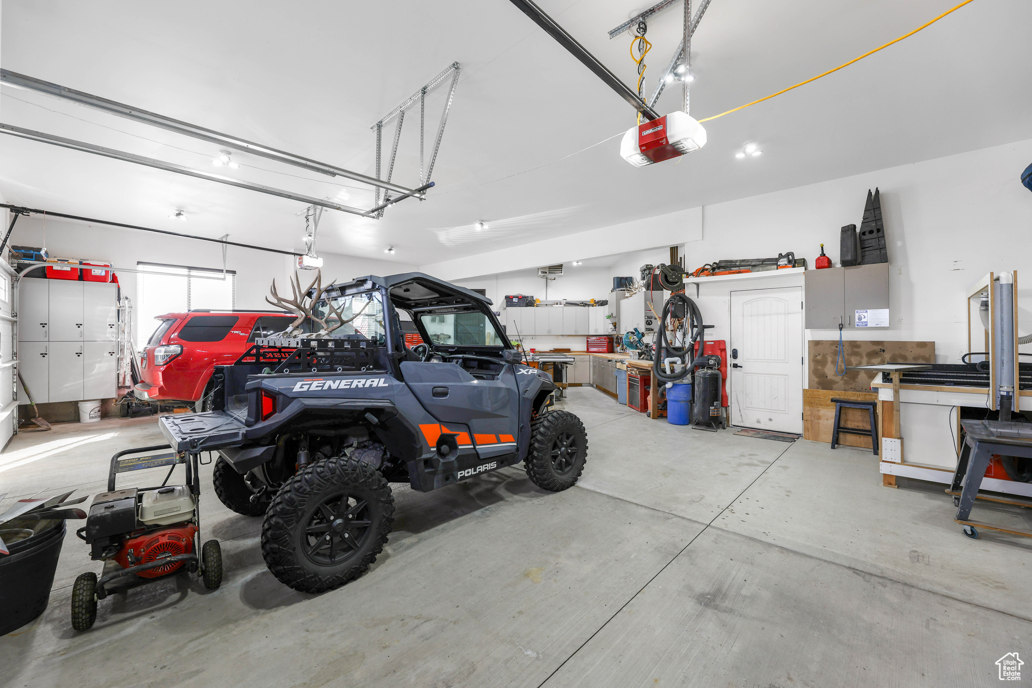 Garage featuring a garage door opener