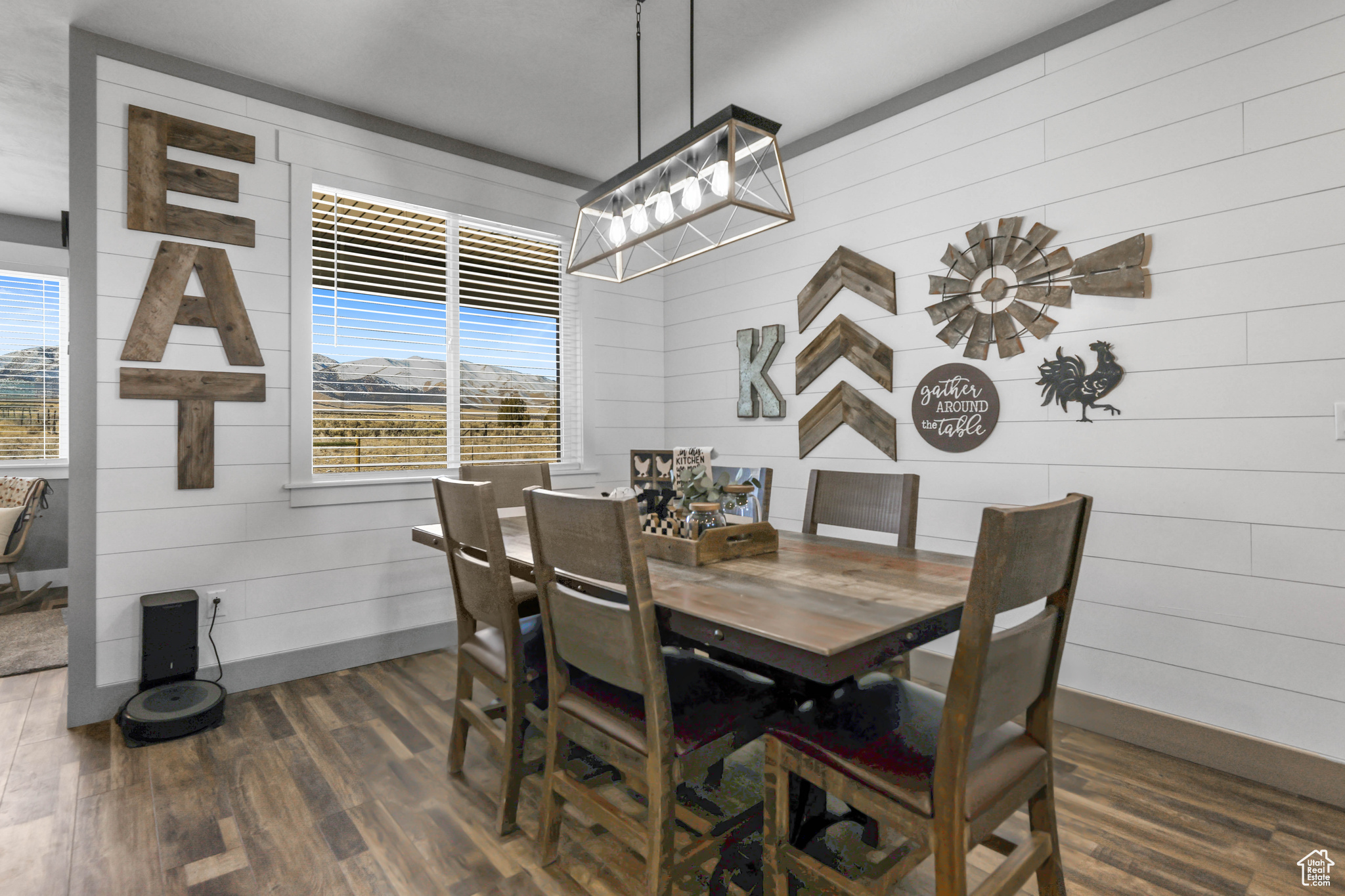 Dining area featuring dark hardwood / wood-style floors and wood walls