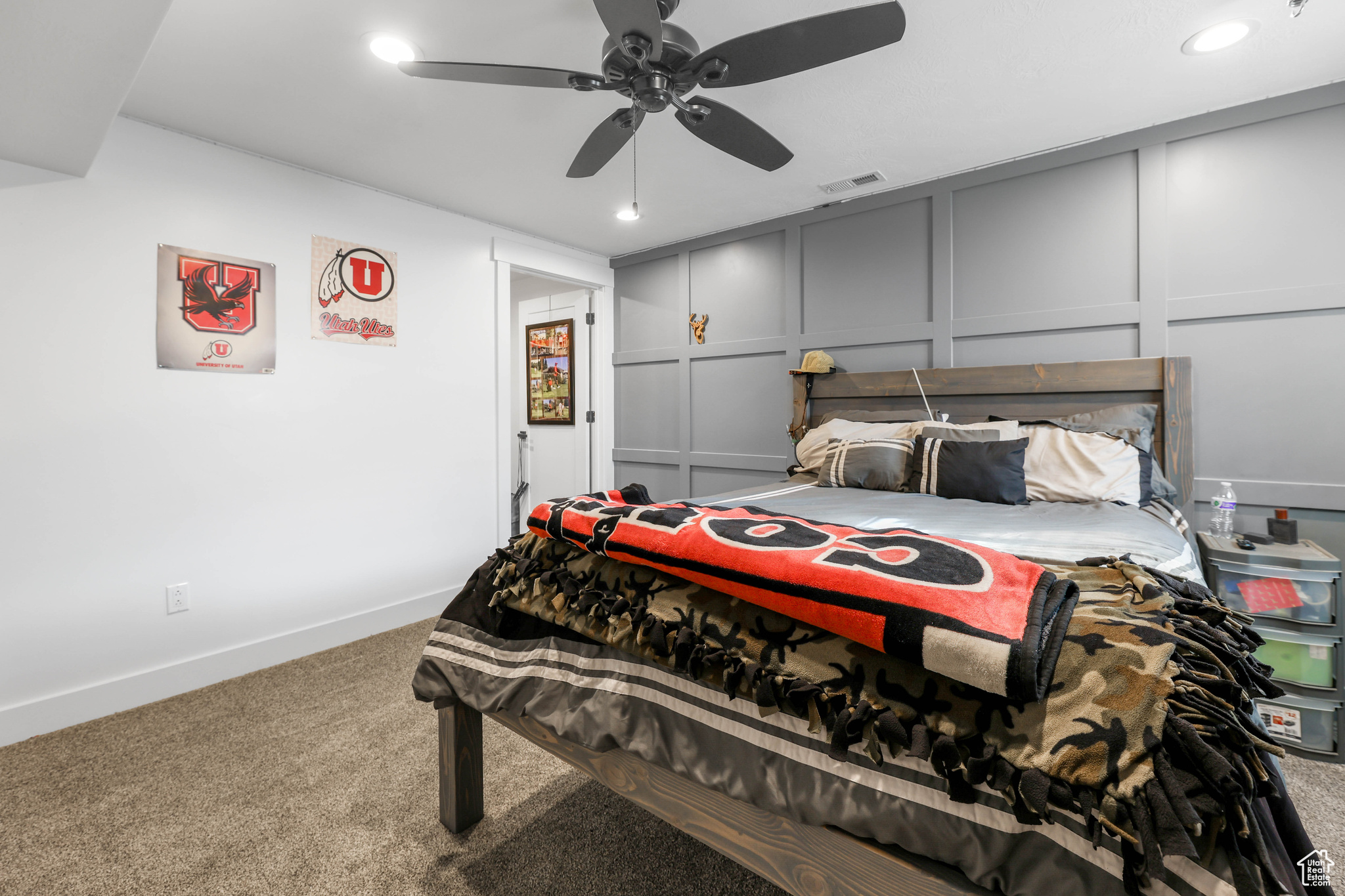 Bedroom featuring ceiling fan and carpet floors