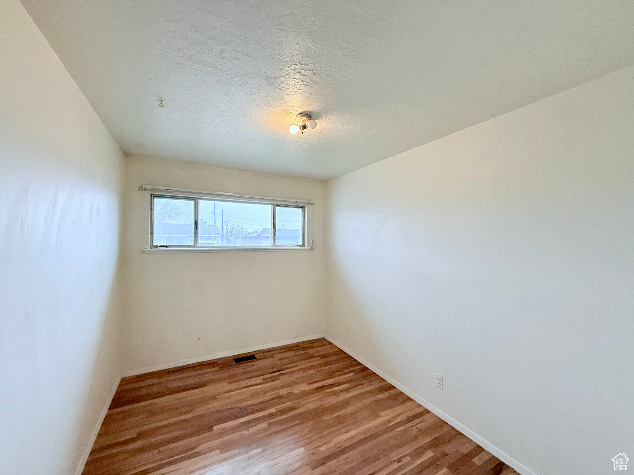 Bedroom with hardwood floors