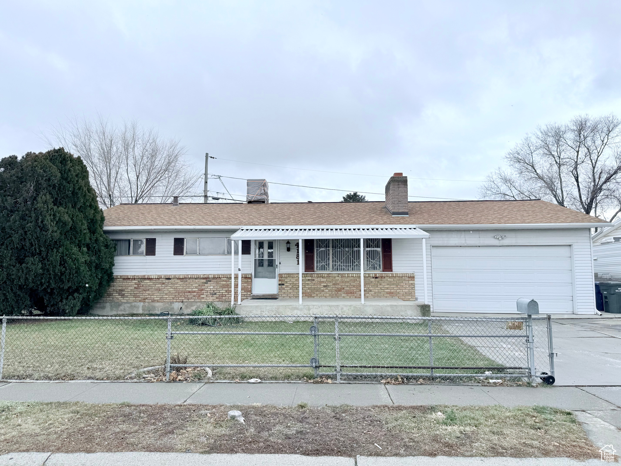 Ranch-style house featuring a 2 car garage and a porch