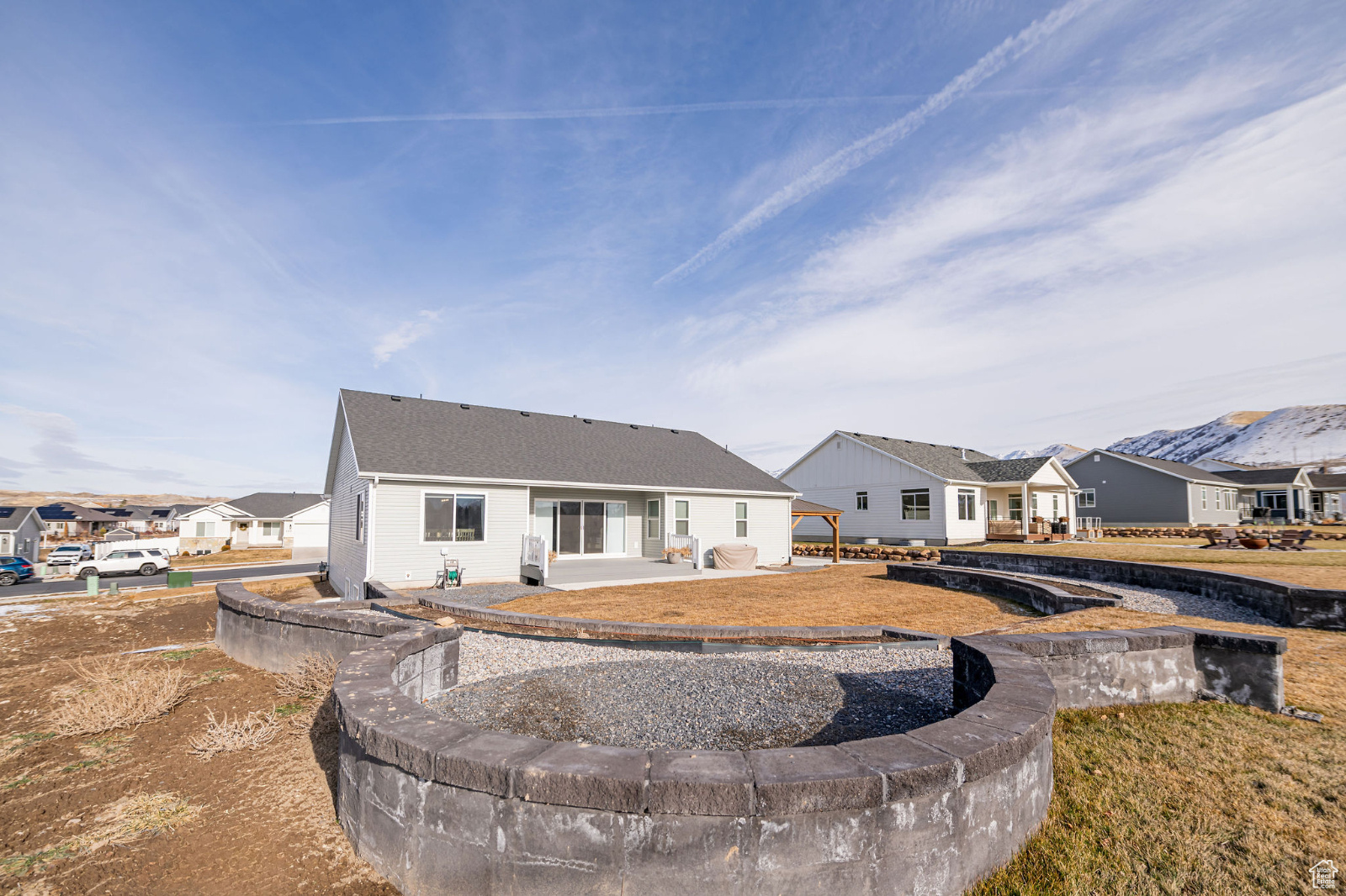 Rear view of house with a fire pit area