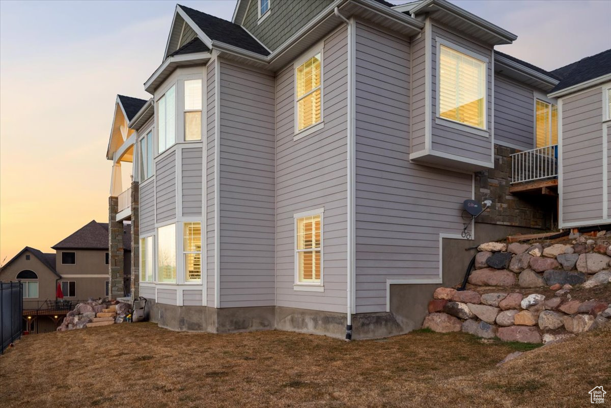 View of property exterior at dusk